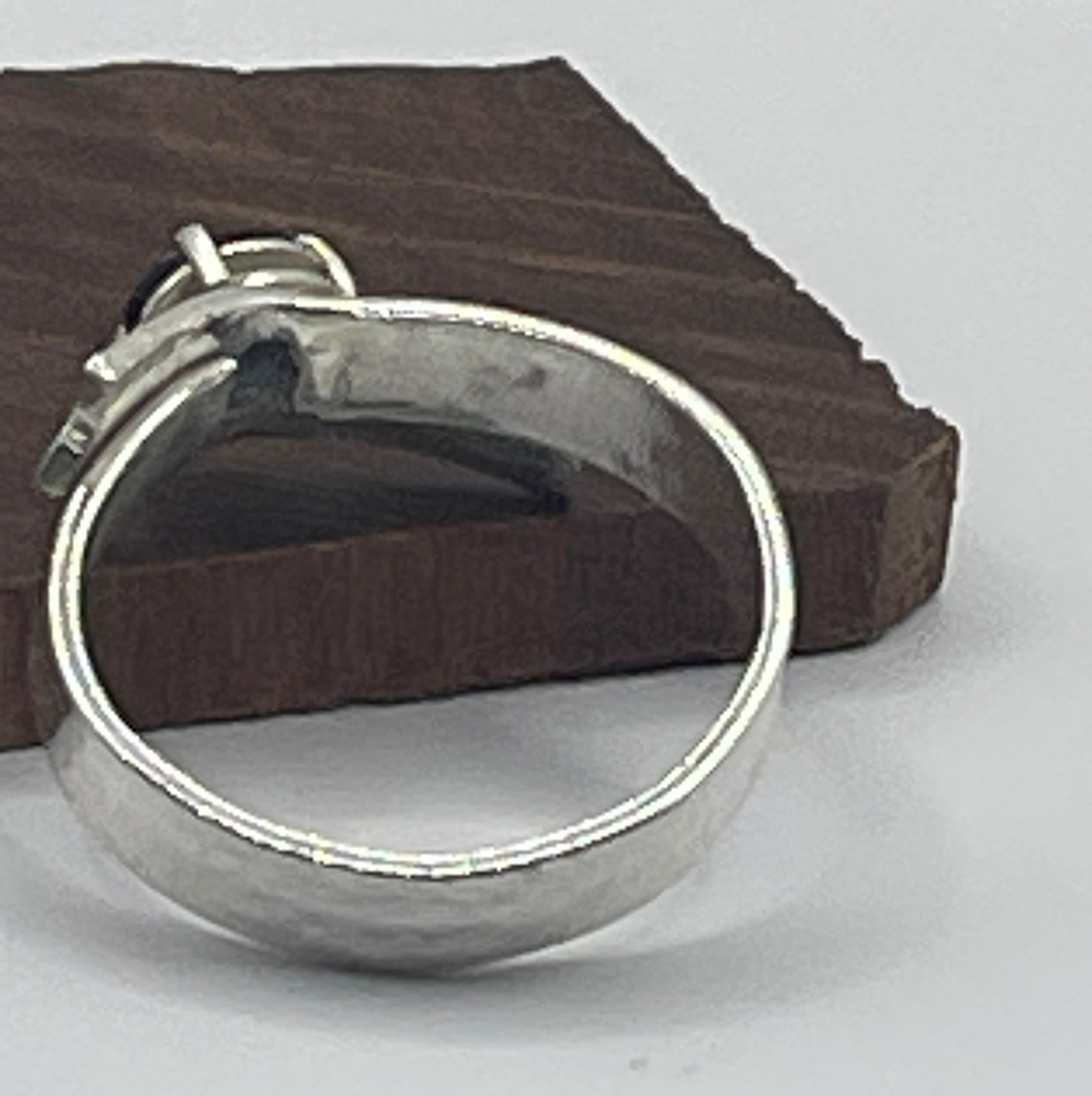 Sterling silver textured ring, bow with blue sapphire