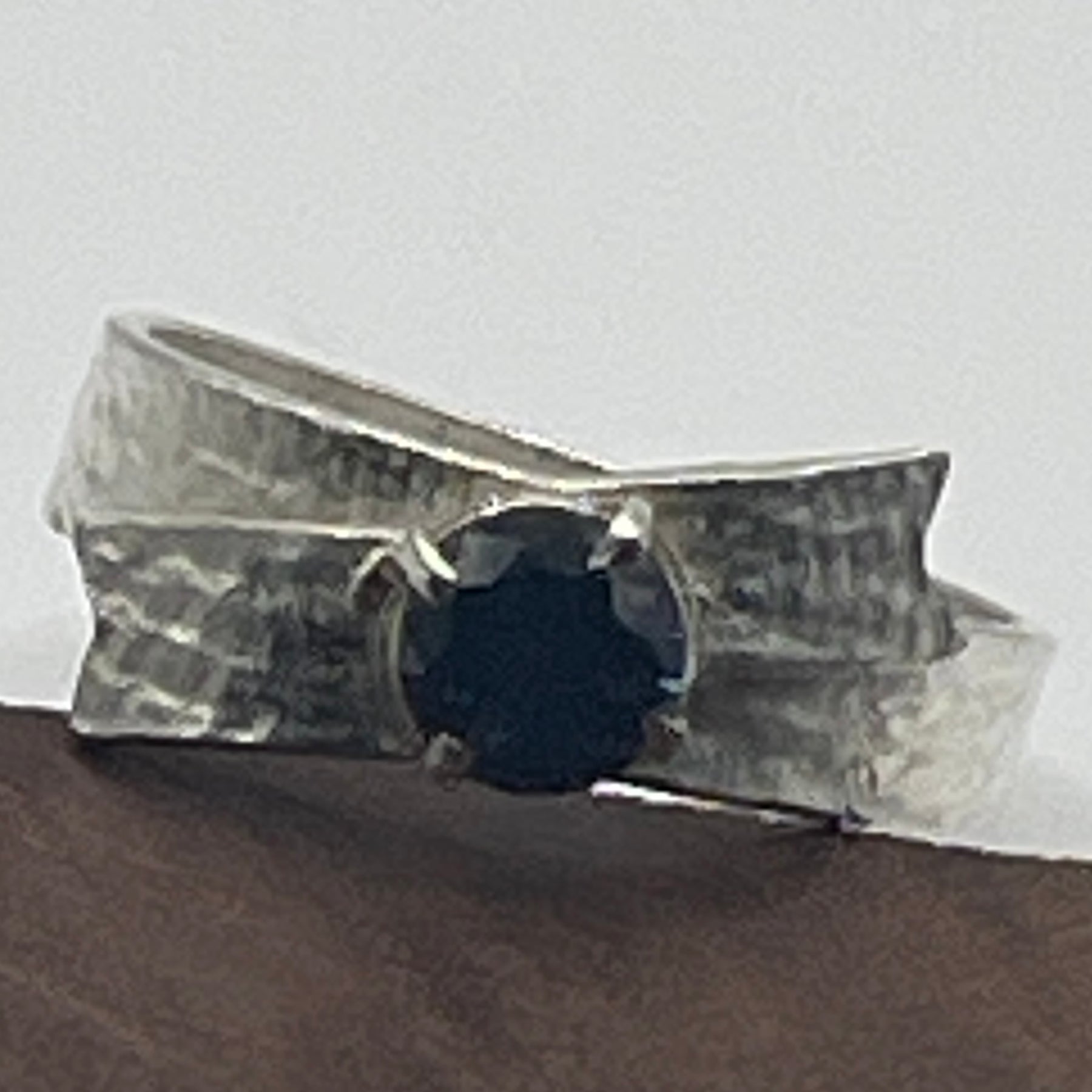 Sterling silver textured ring, bow with blue sapphire