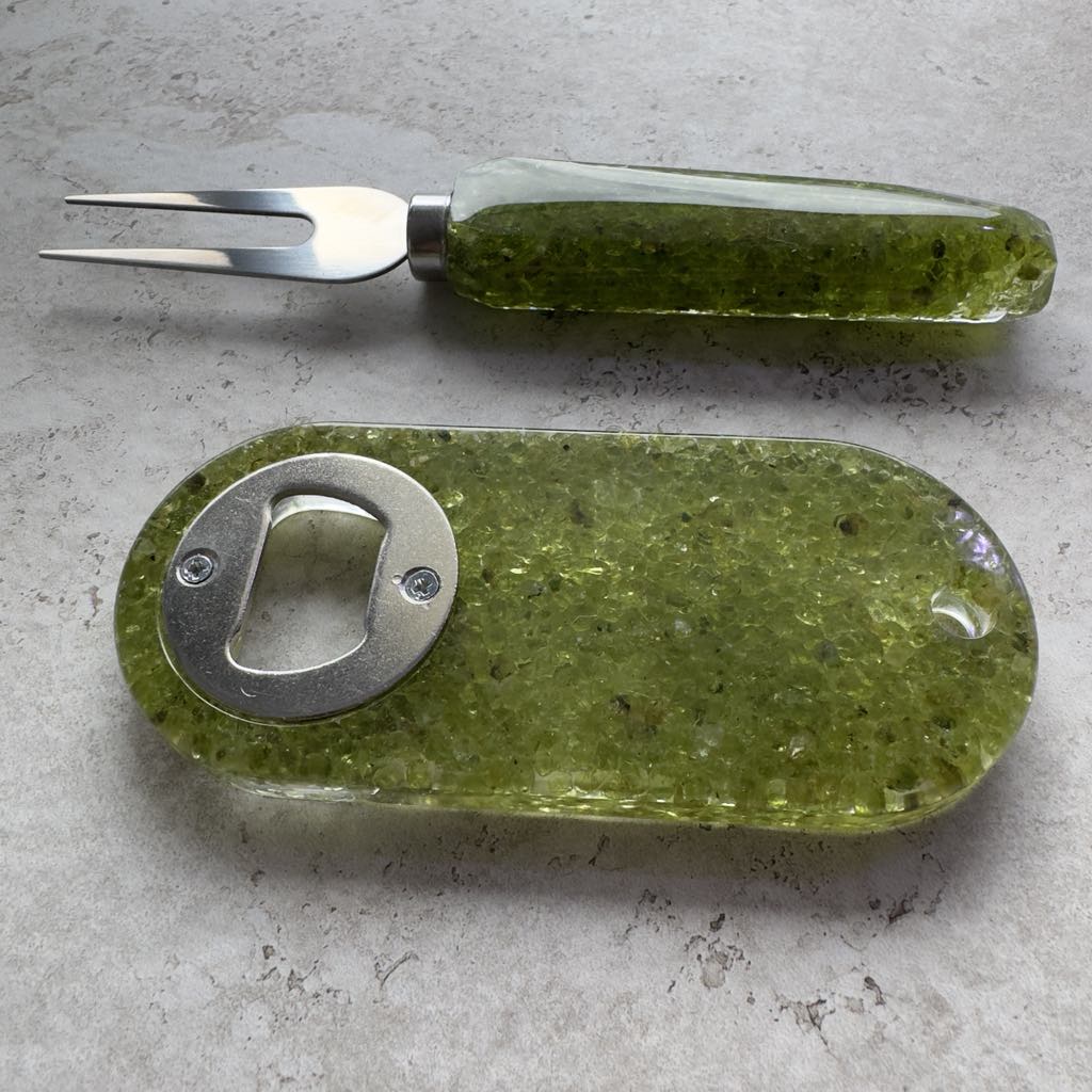 Resin bottle opener with inlaid peridot stones