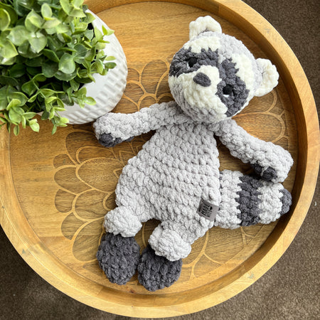 Handmade crochet modern Raccoon lovey snuggler with knotted legs.
