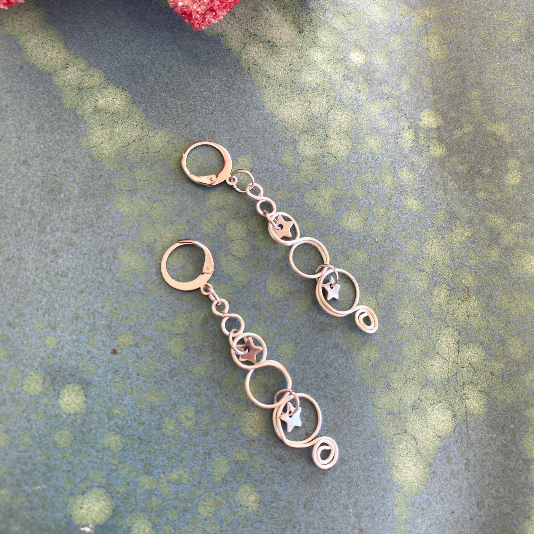 Silver Looped Earrings With Twinkling Stars