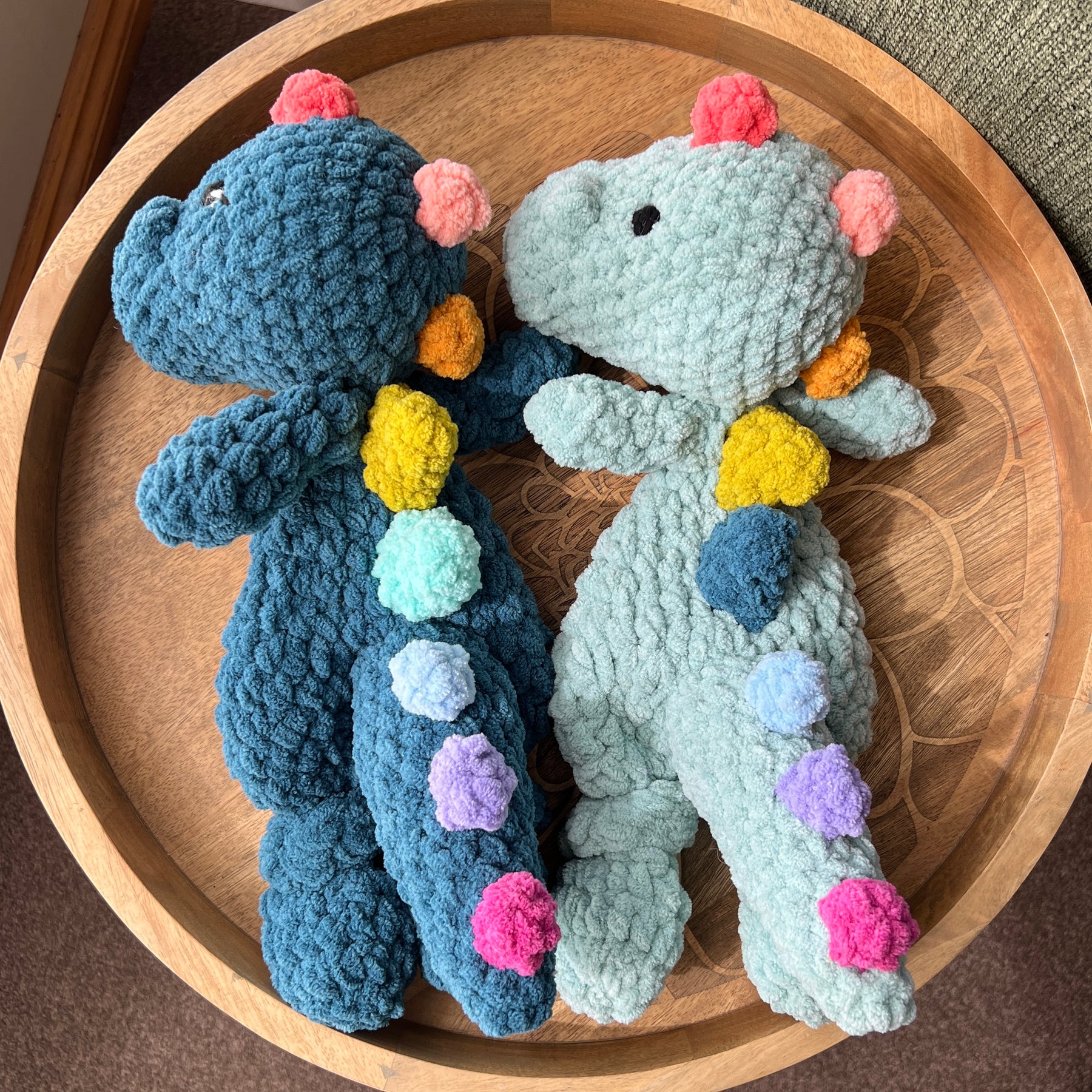 (Copy) Handmade crochet Dinosaur modern lovey snuggler with knotted legs and rainbow spikes.