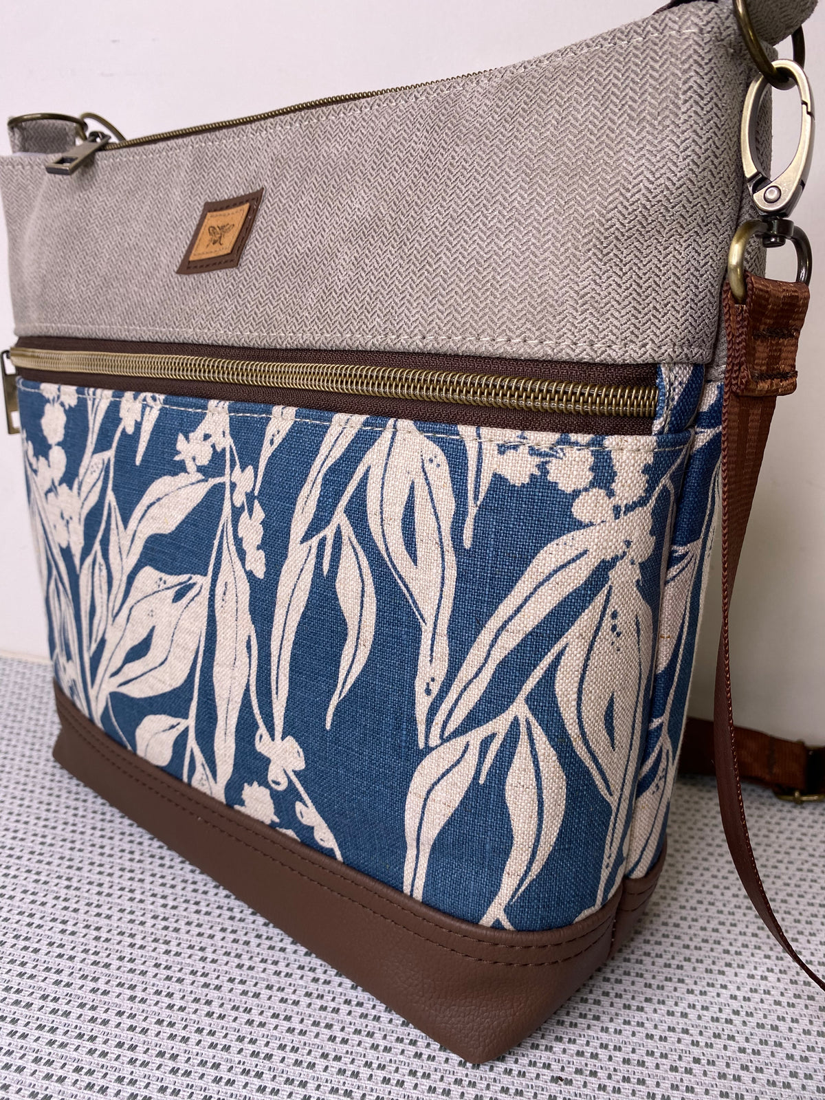 Lola Crossbody Bag - Hand Screen Printed Linen in Blue Gum leaves and Beige Fabric with Dark BrownFaux Leather Base