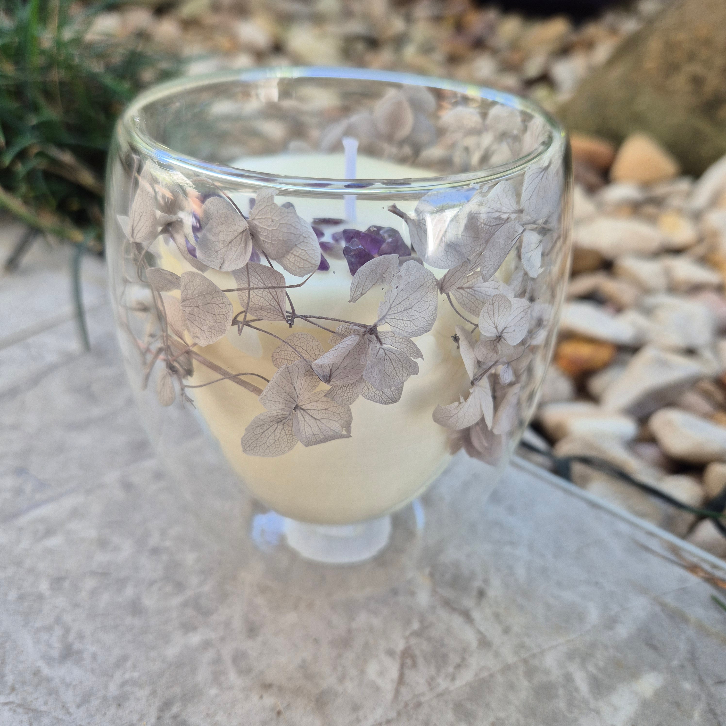 Glass container candle with lavender and dried hydrangeas