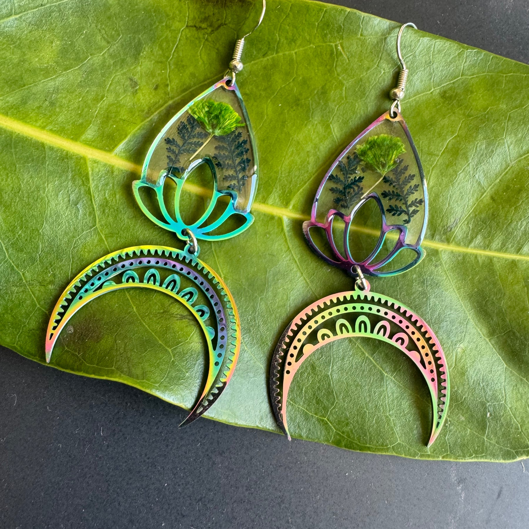 Iridescent rainbow resin earrings with pressed flowers