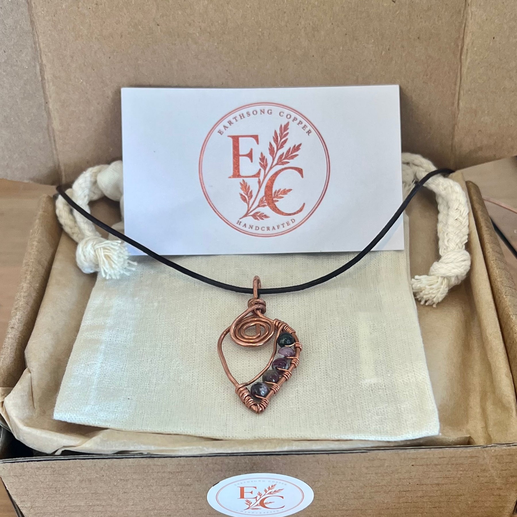 Unique Copper Spiral Gemstone Pendant with brown cord
