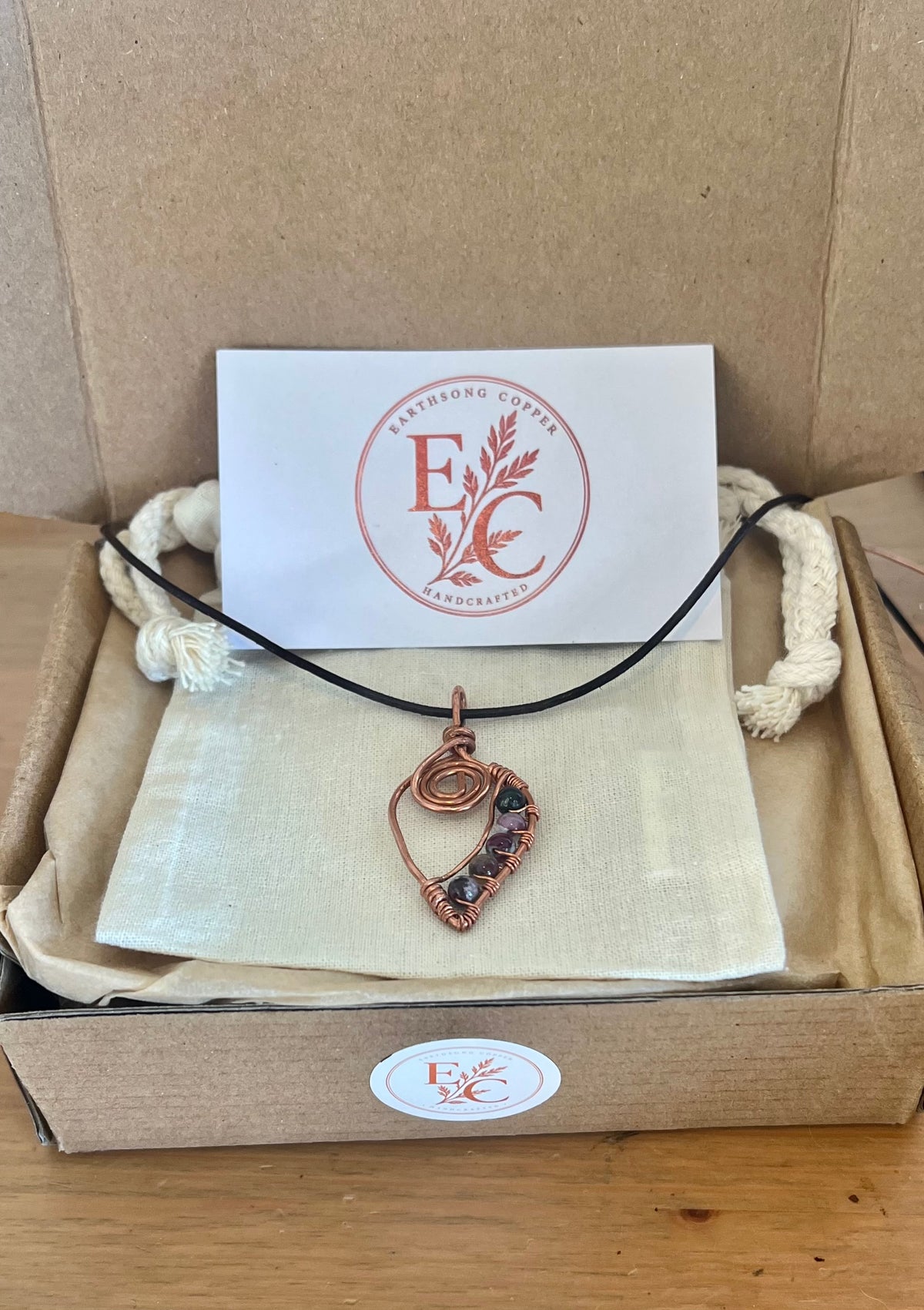 Unique Copper Spiral Gemstone Pendant with brown cord