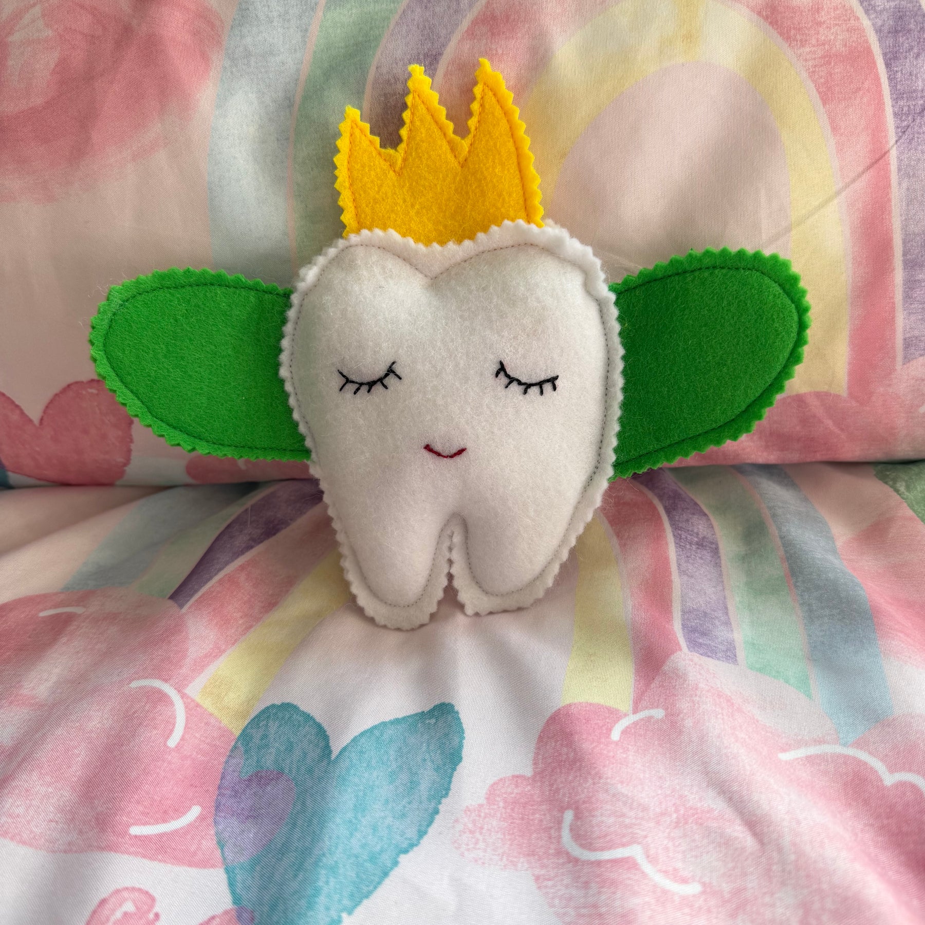 Tooth fairy snuggle toy with tooth pouch