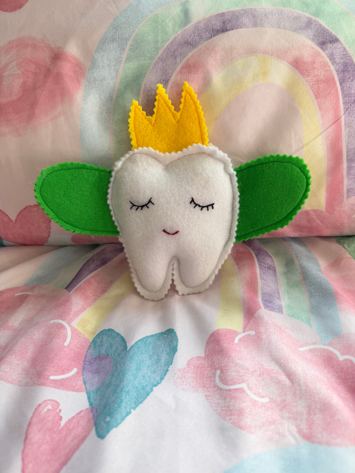 Tooth fairy snuggle toy with tooth pouch