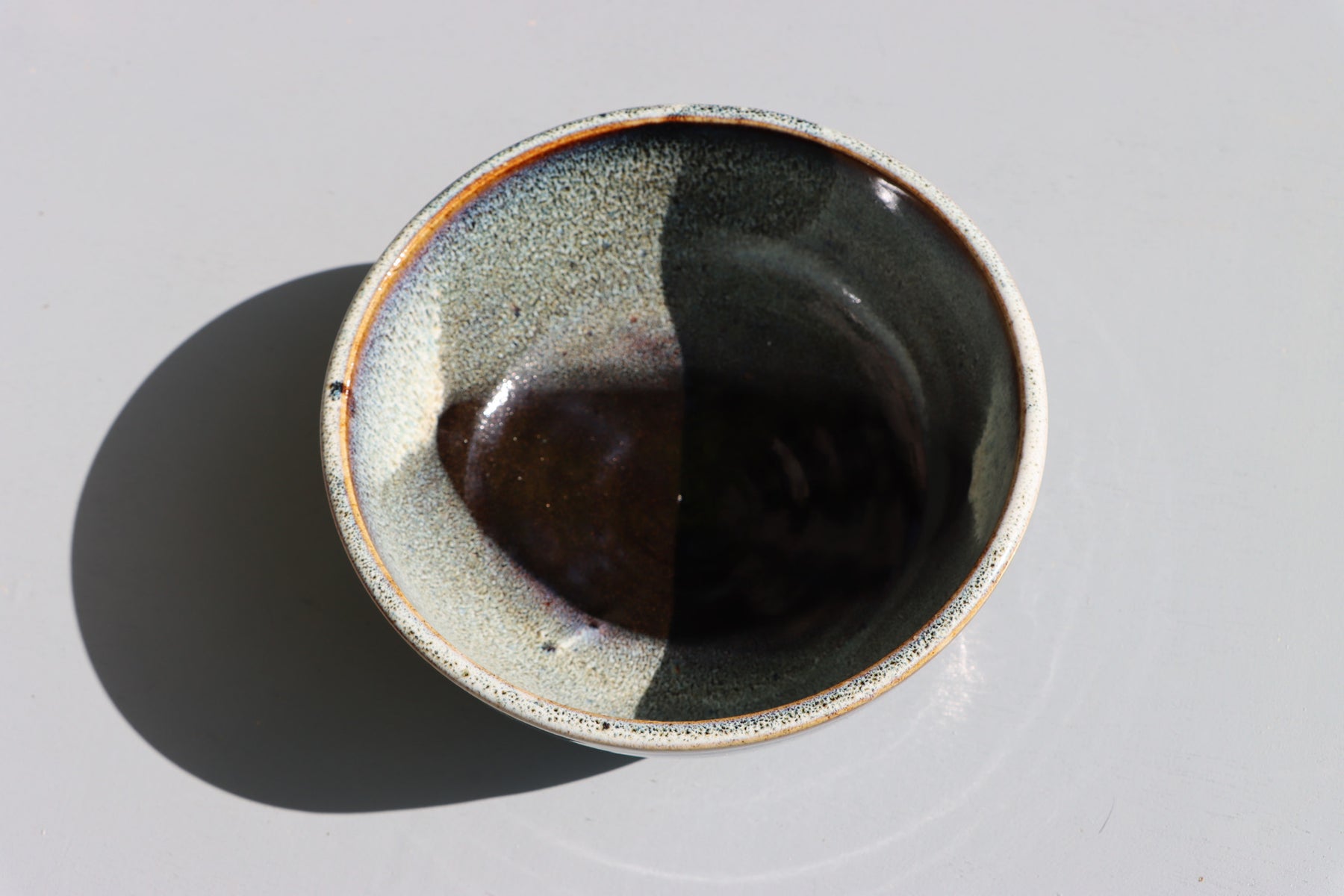 Stoneware bowls hand made with white speckled chun glaze over teadust brown.