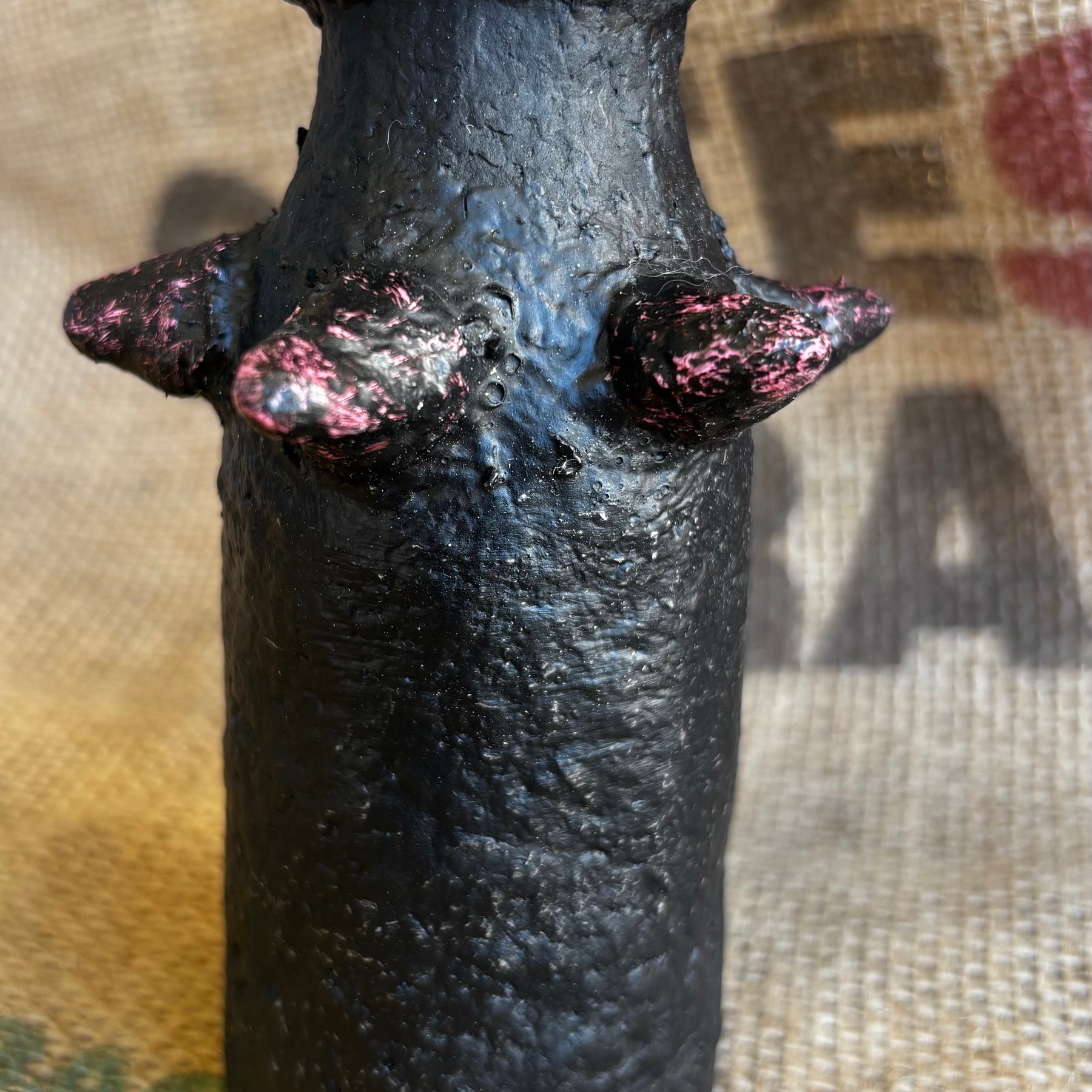 Small vase with pinkish studs