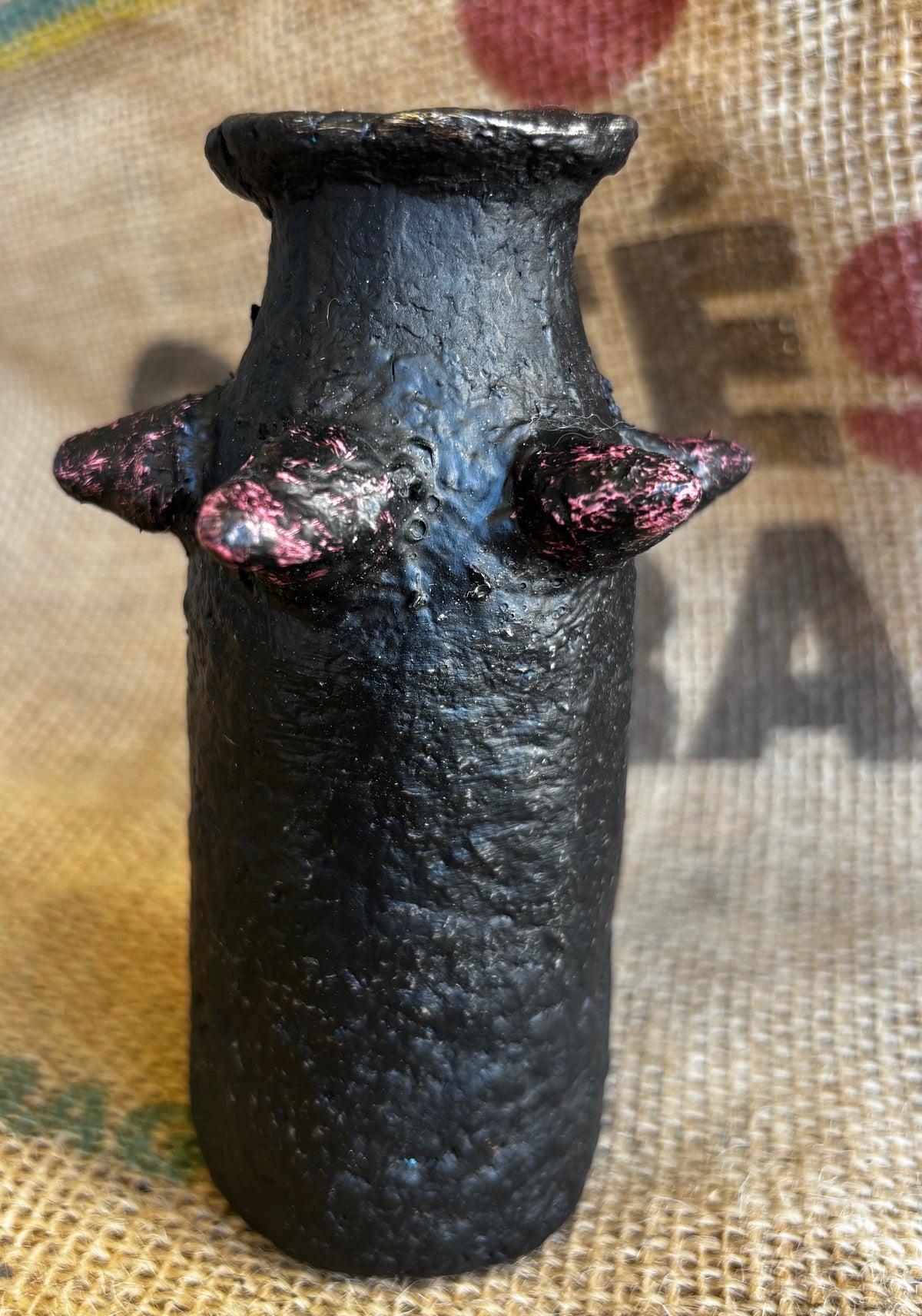 Small vase with pinkish studs