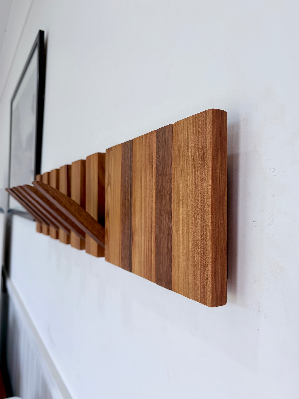 Two tone spotted gum and cypress horizon line piano style coatrack
