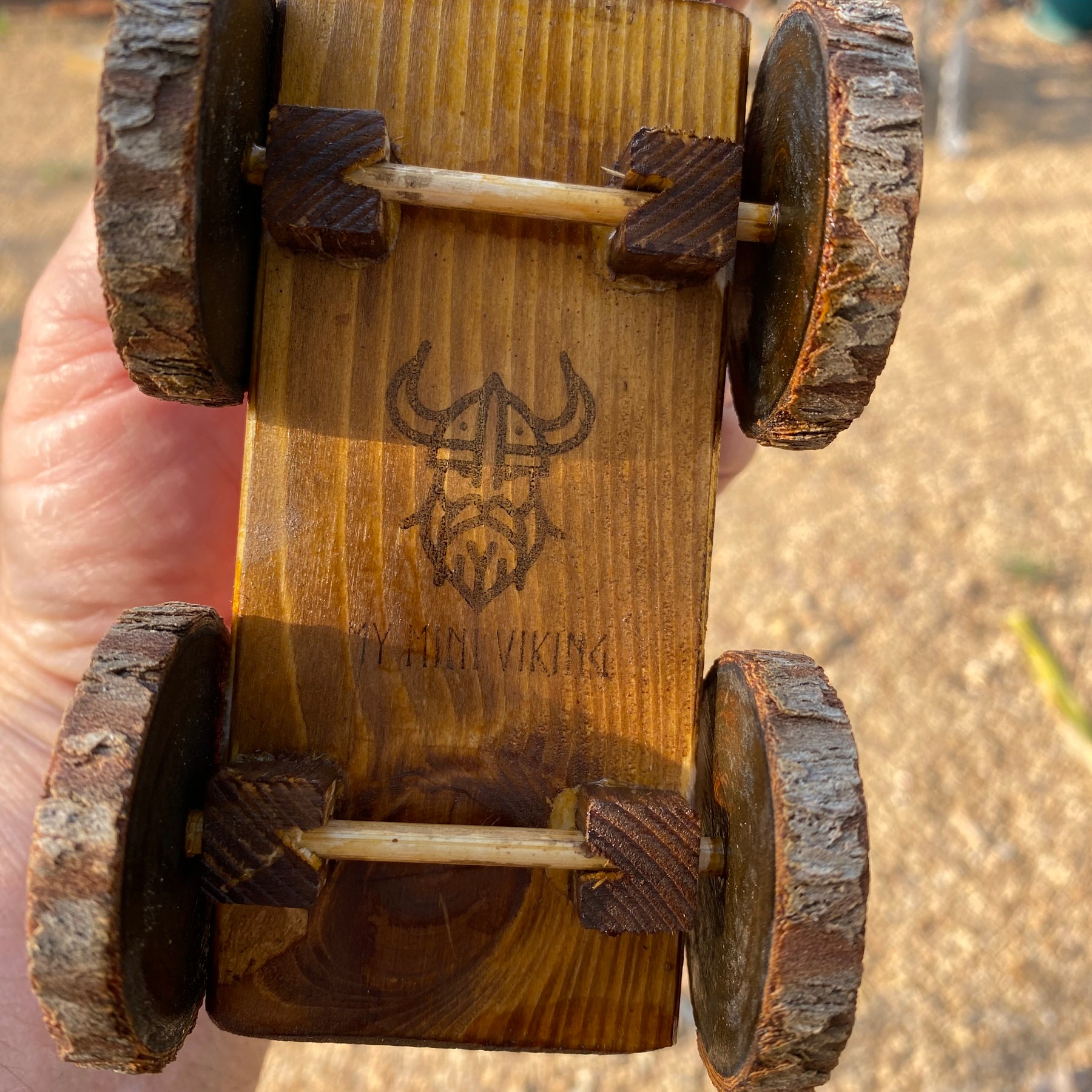 Handmade wooden cow and wagon