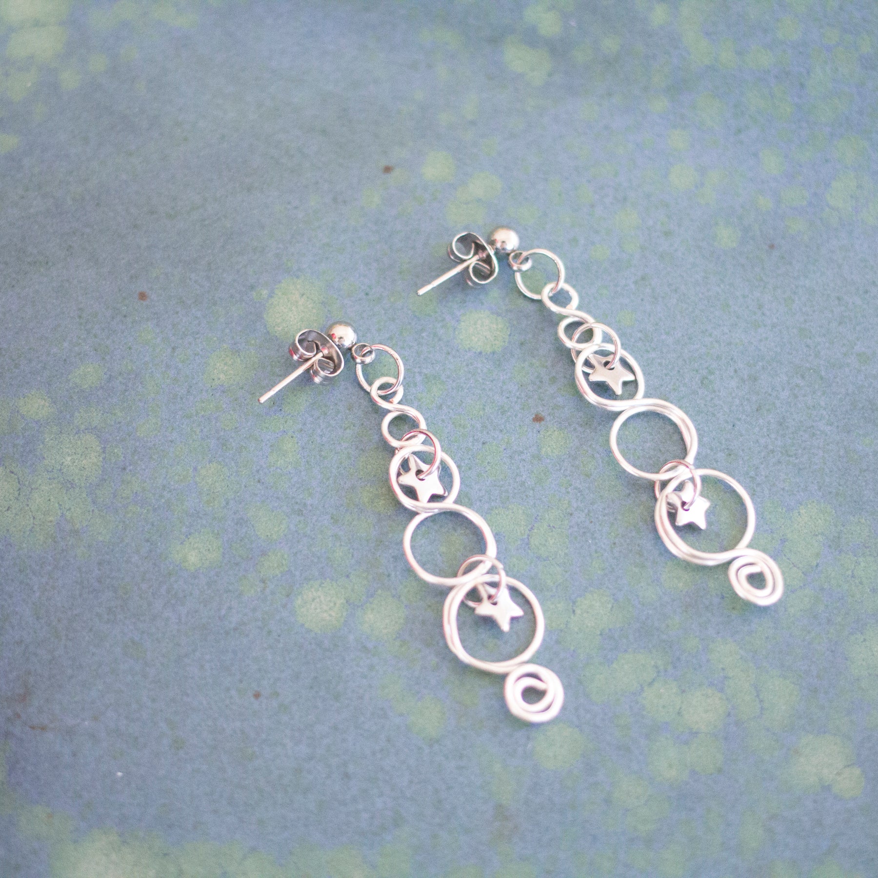 Silver Looped Earrings With Twinkling Stars | Christmas Earrings