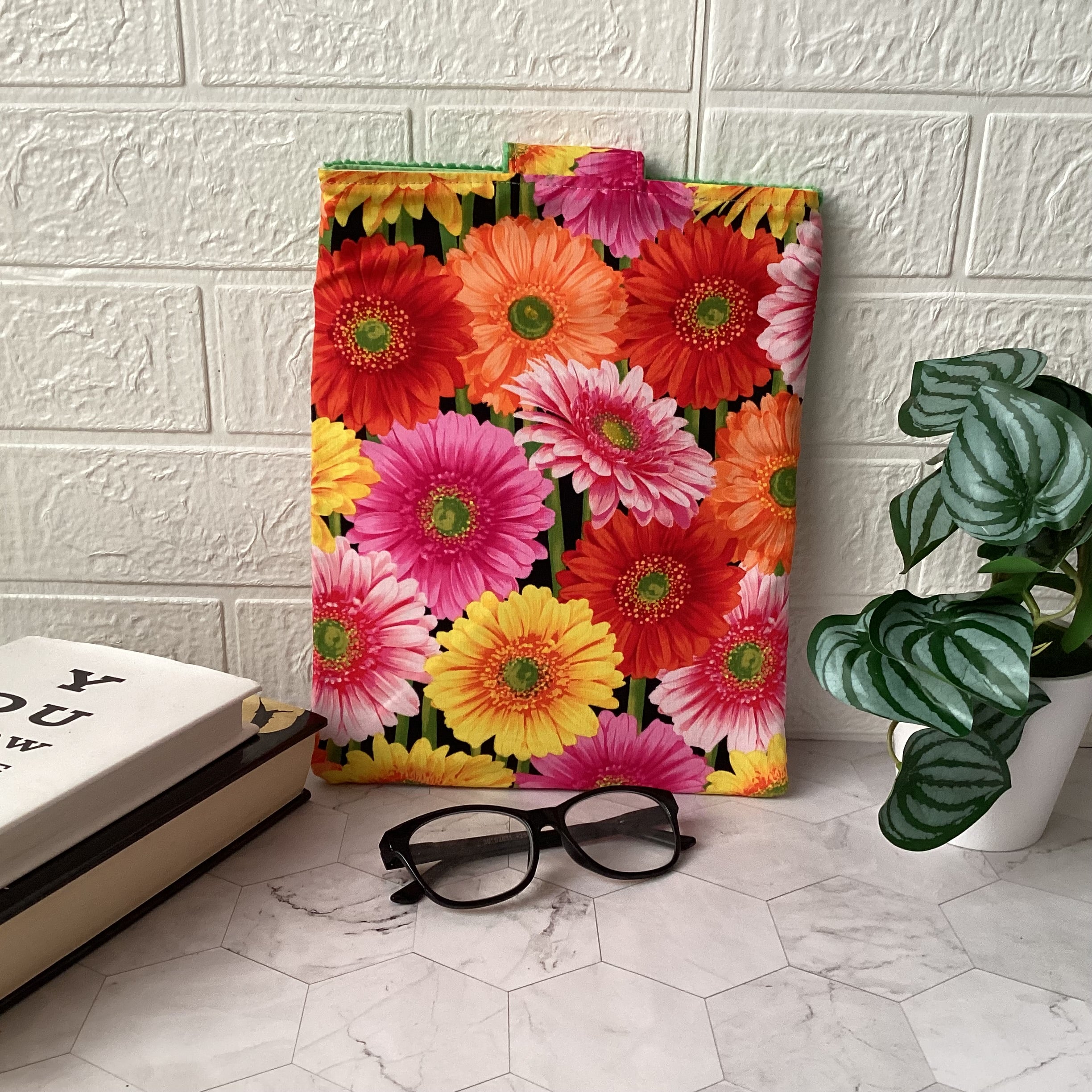 Colourful daisies book sleeve with 2 pockets. iPad, tablet pouch