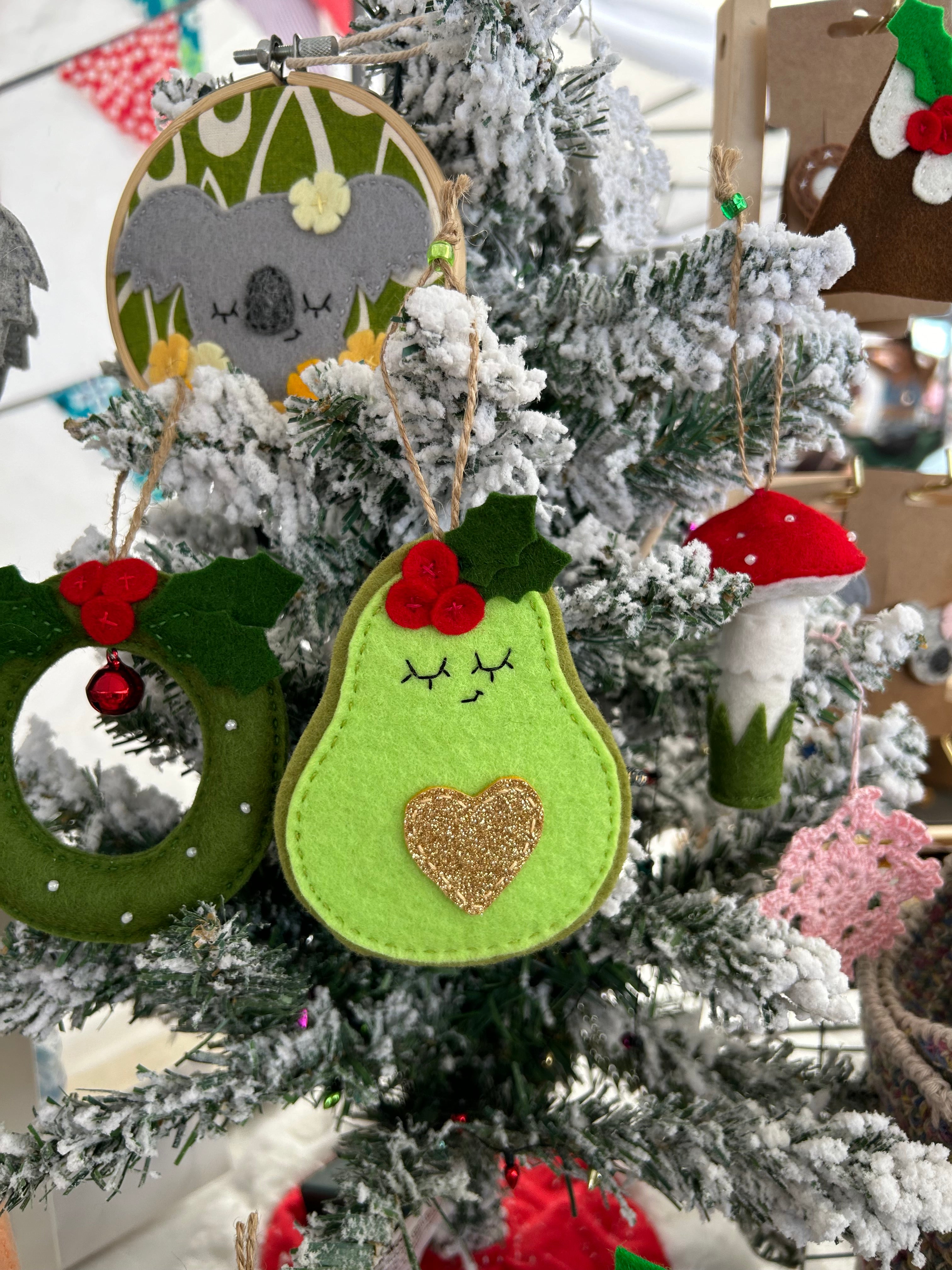 Festive avocado ornament with golden heart