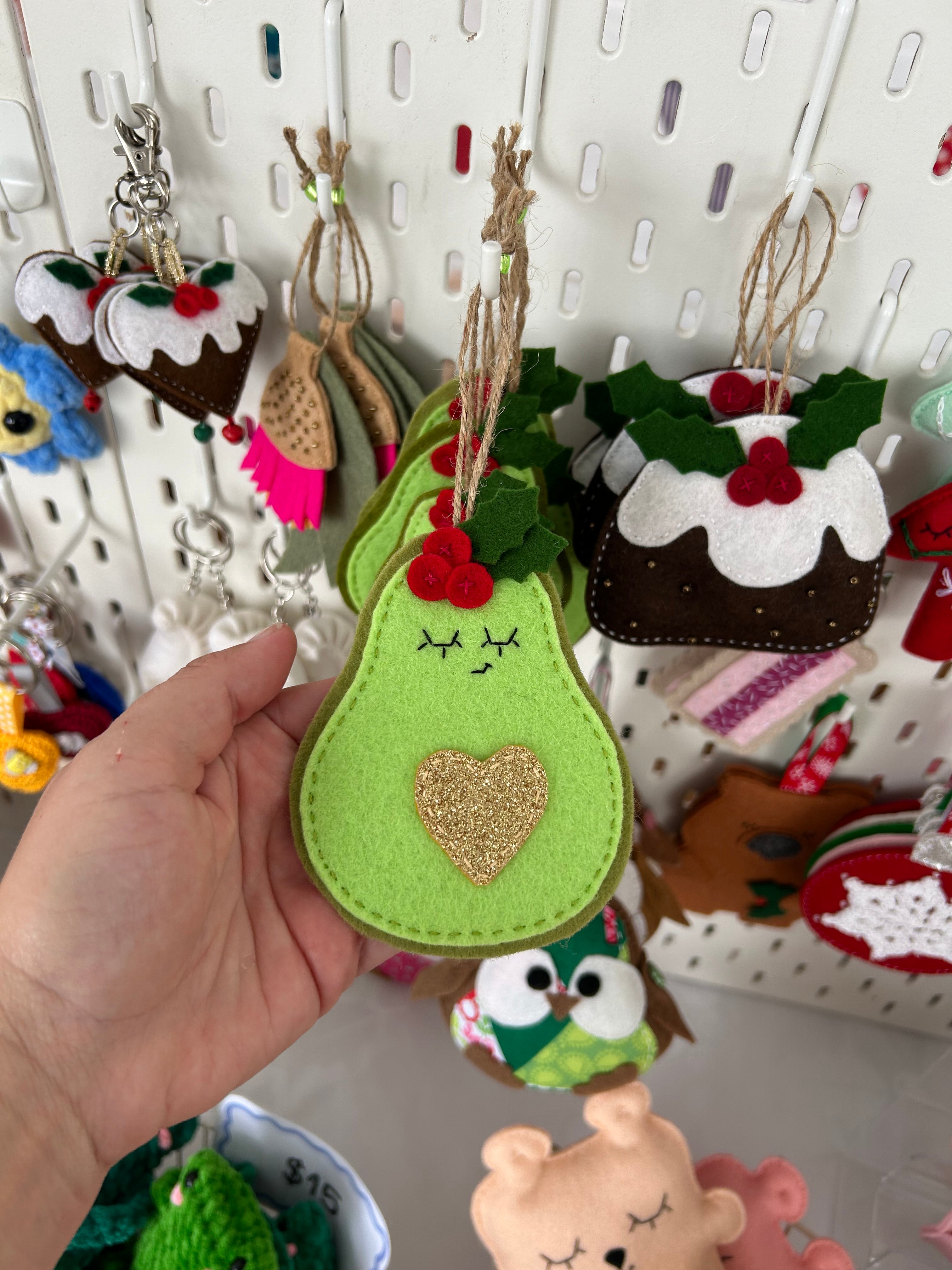 Festive avocado ornament with golden heart