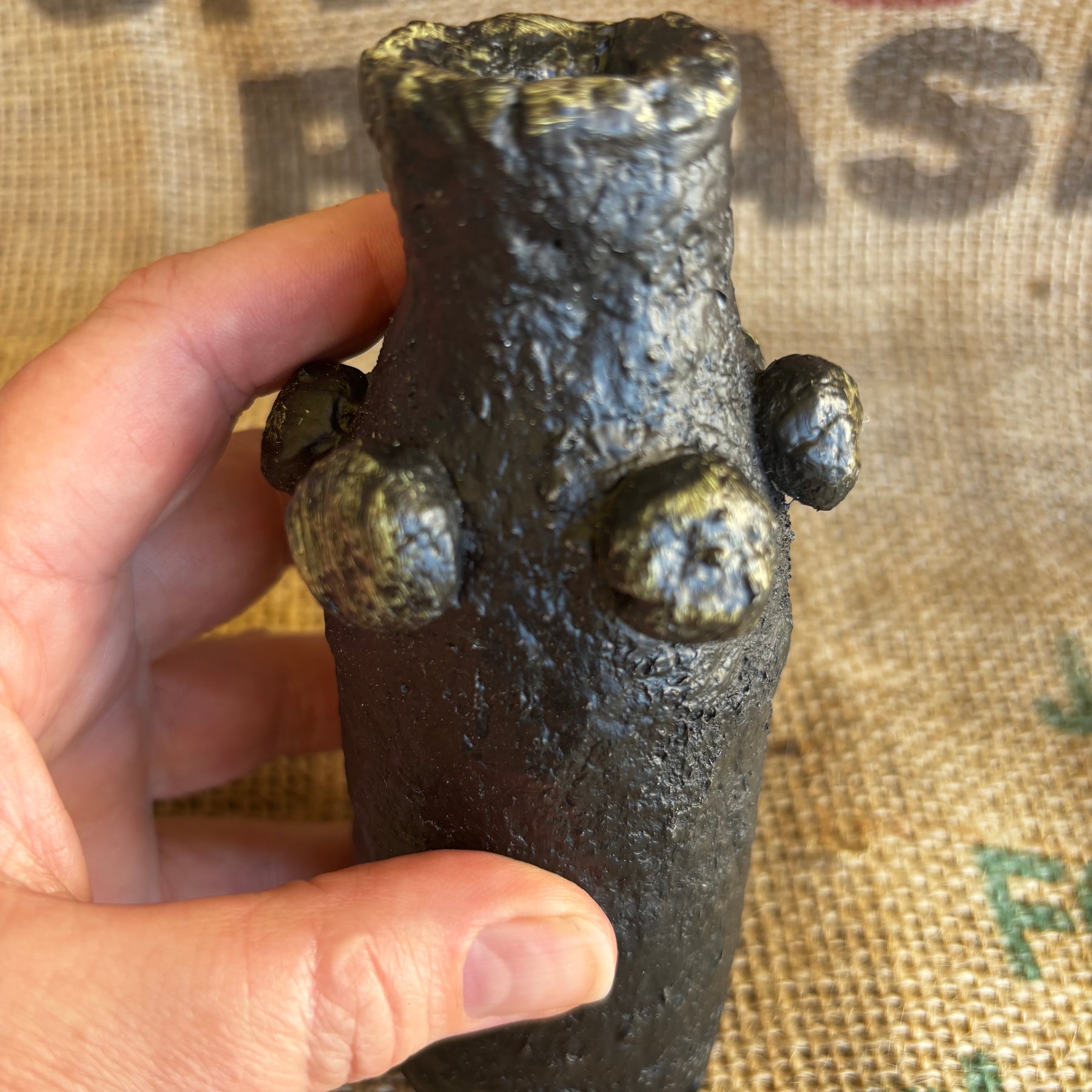 Small black and gold vase