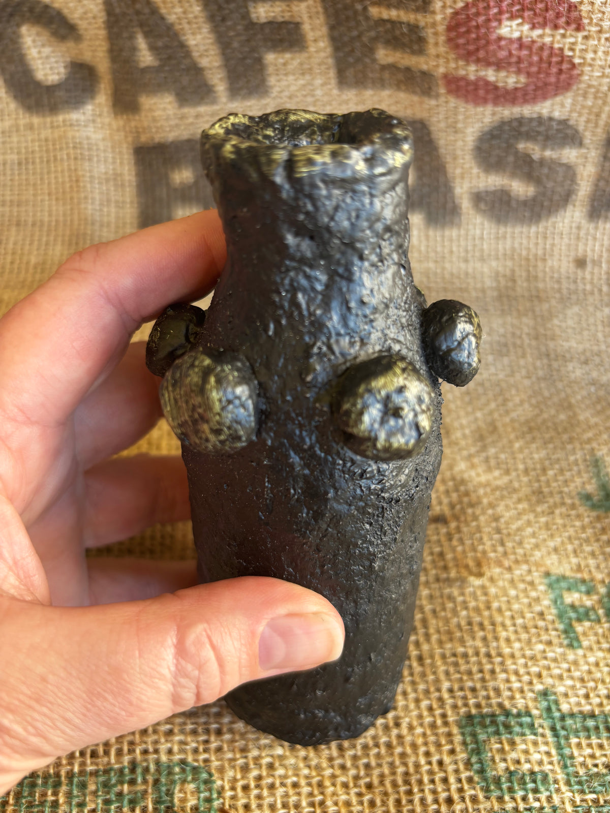 Small black and gold vase