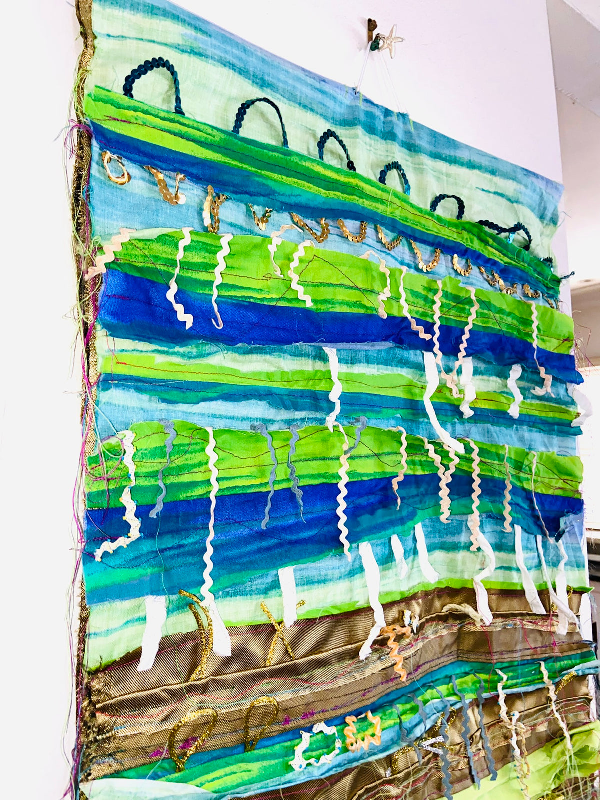 Green, Blue and Gold textile wall hanging