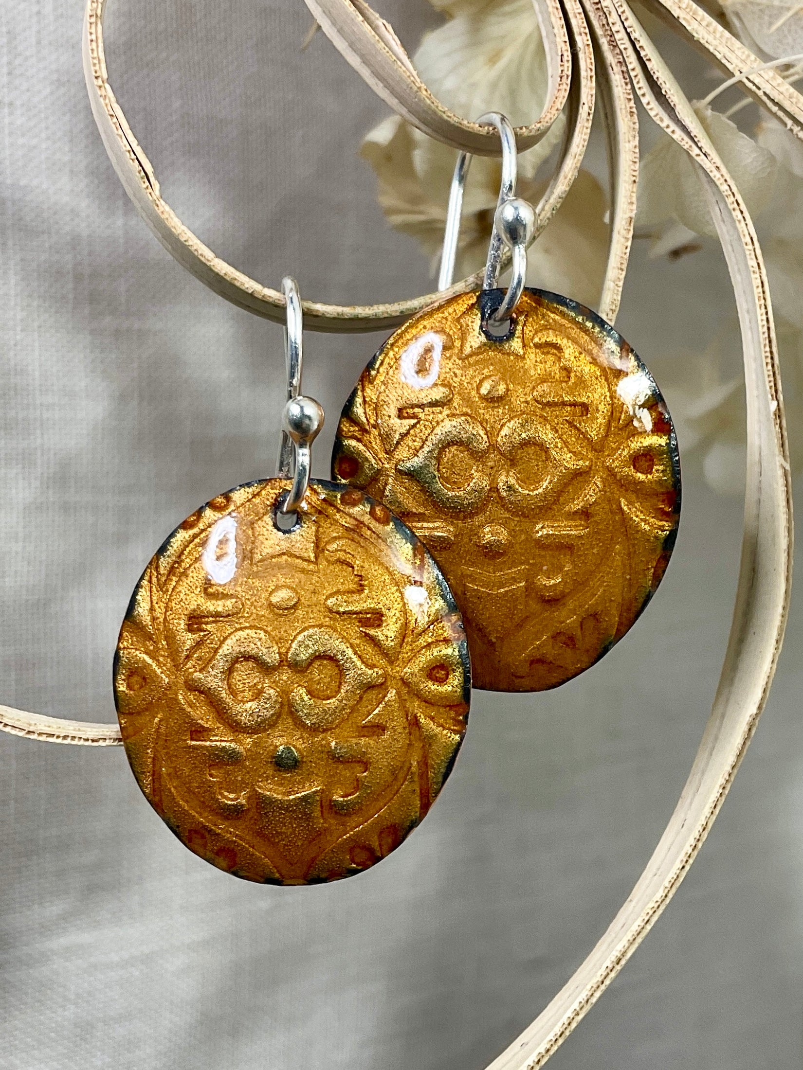 Gold embossed enamel earrings. Handmade