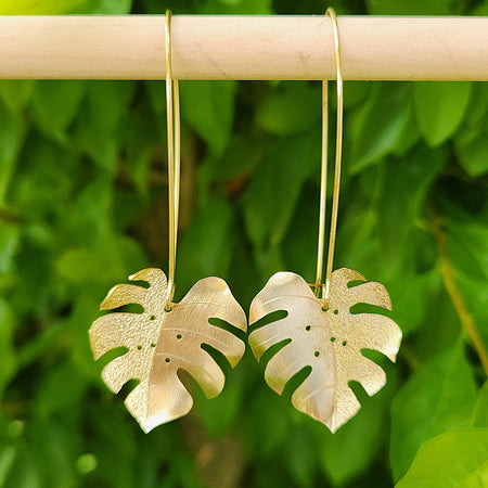 Golden tone monstera earrings