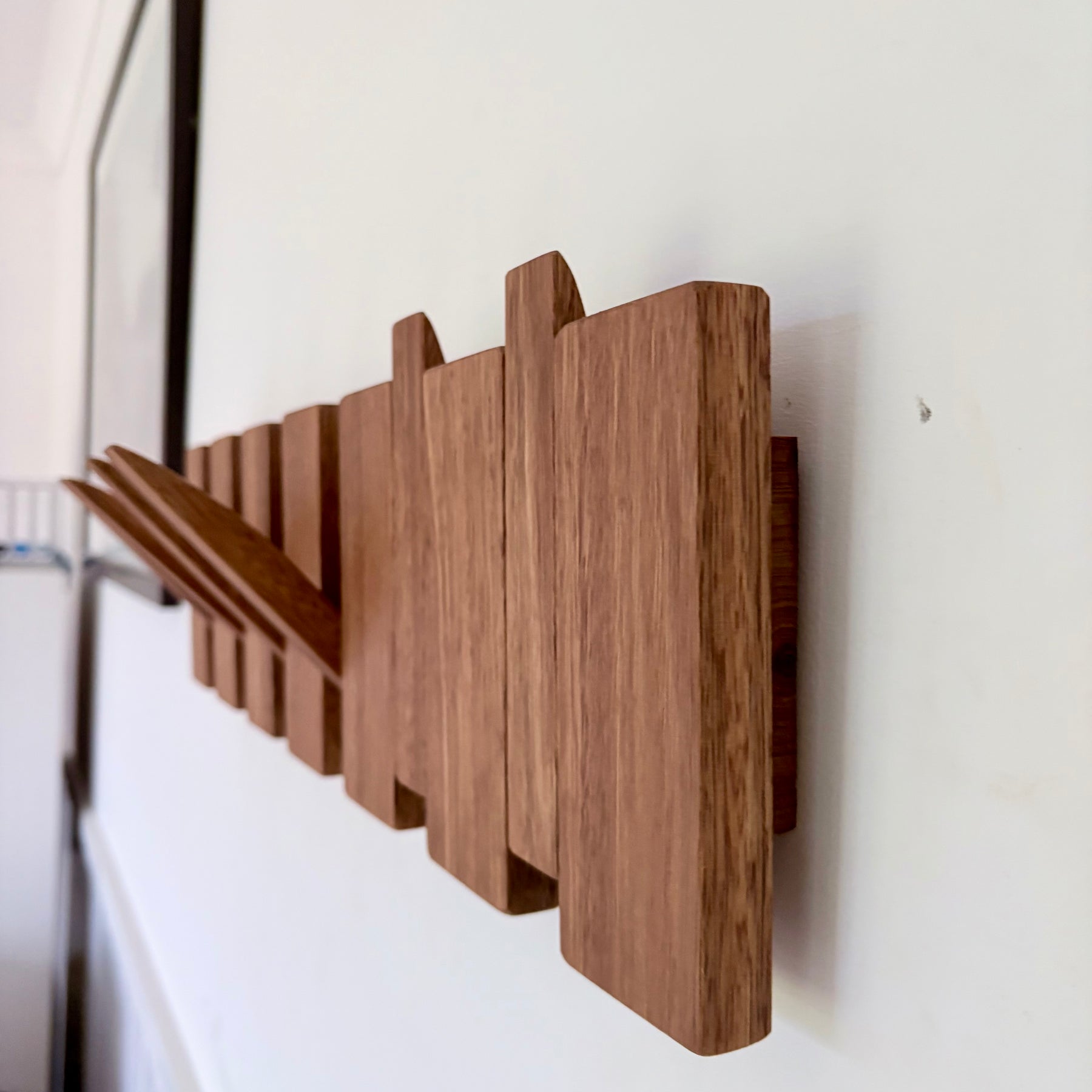 Grey box piano style coat rack