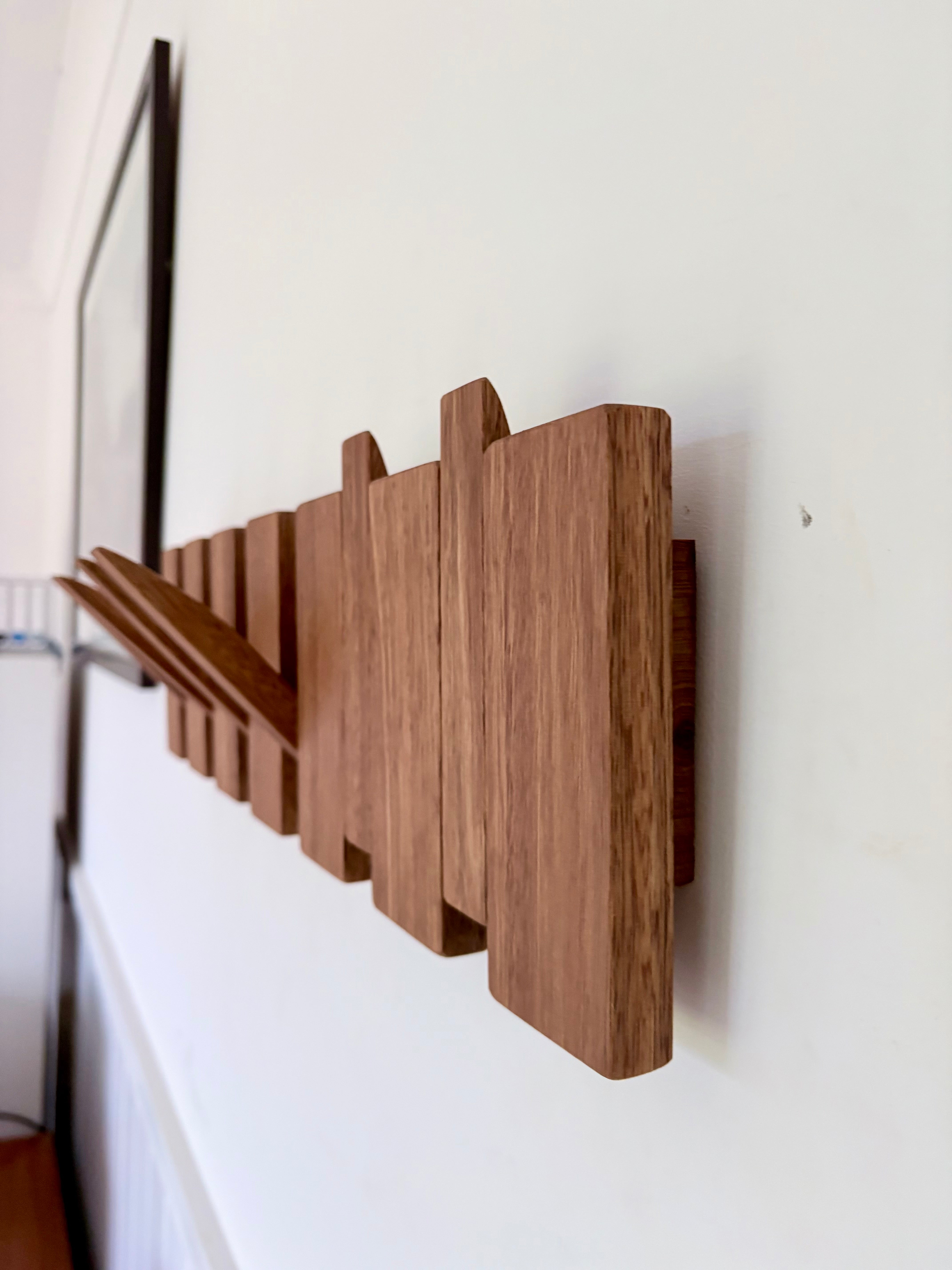 Grey box piano style coat rack