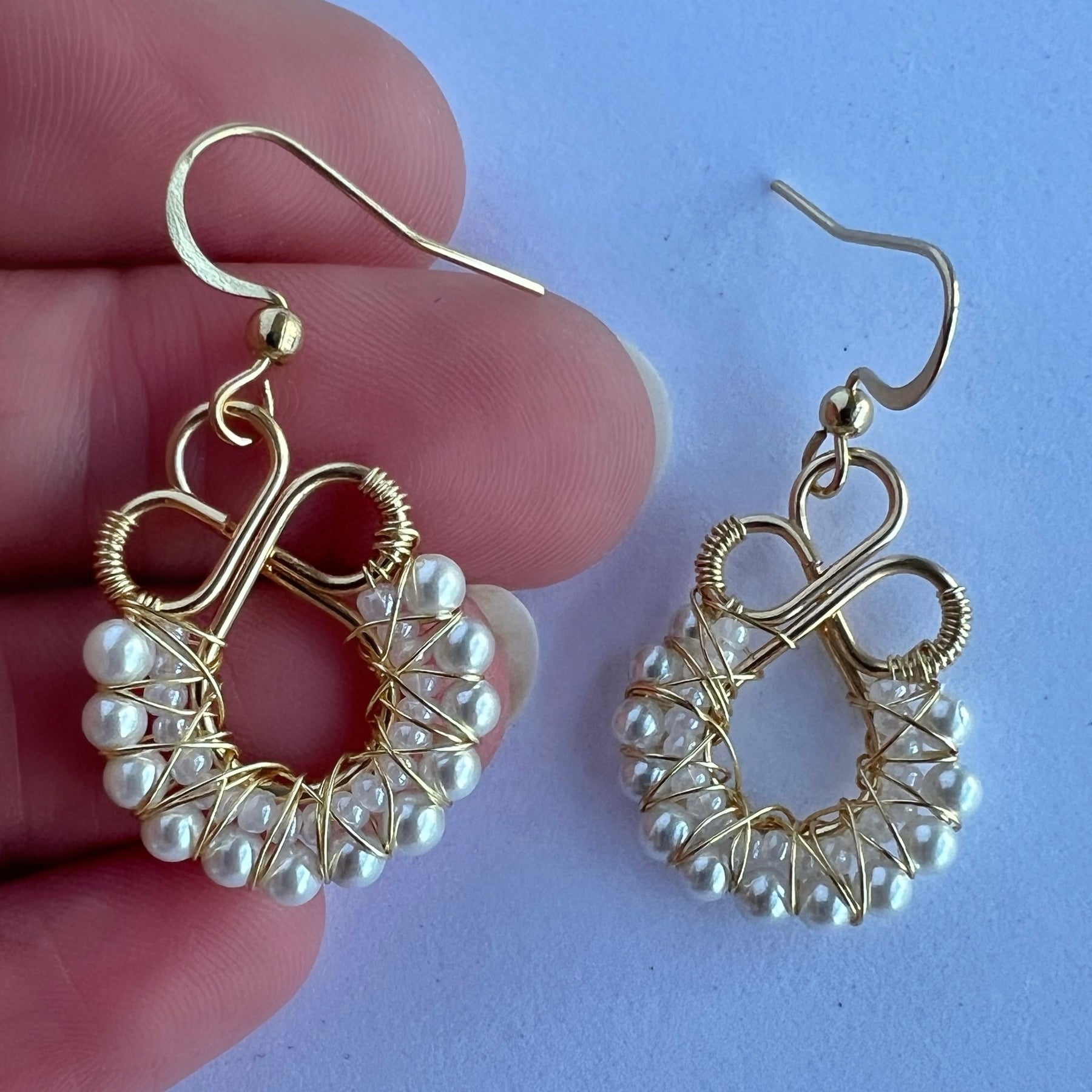 Gold wire wrapped earrings with shell based peals and Czech seee beads