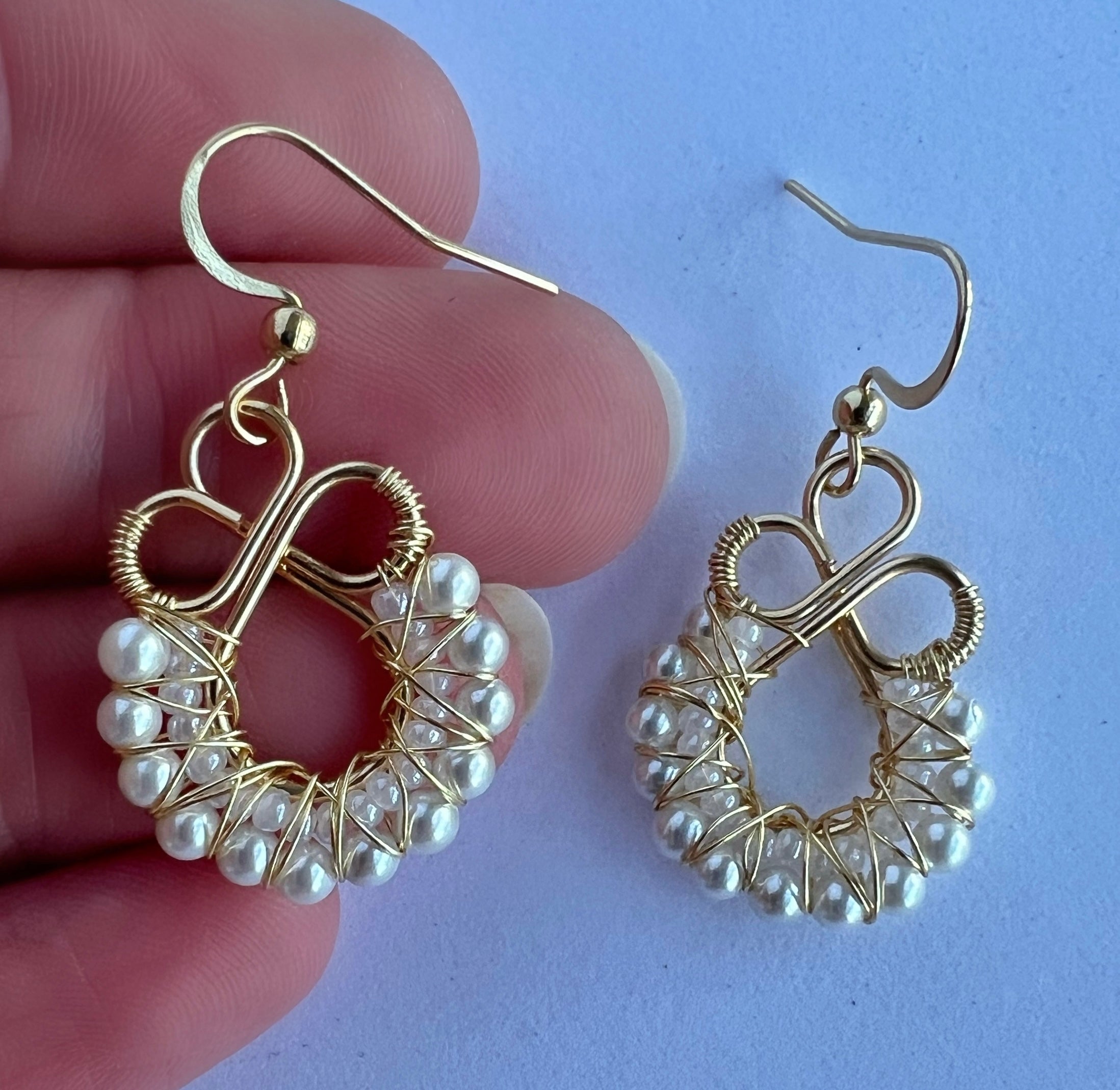 Gold wire wrapped earrings with shell based peals and Czech seee beads