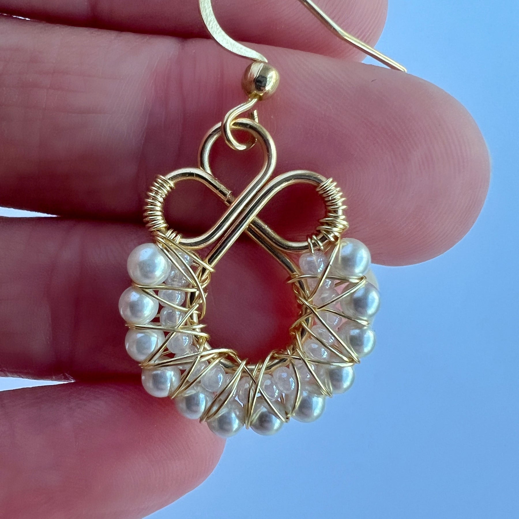 Gold wire wrapped earrings with shell based peals and Czech seee beads