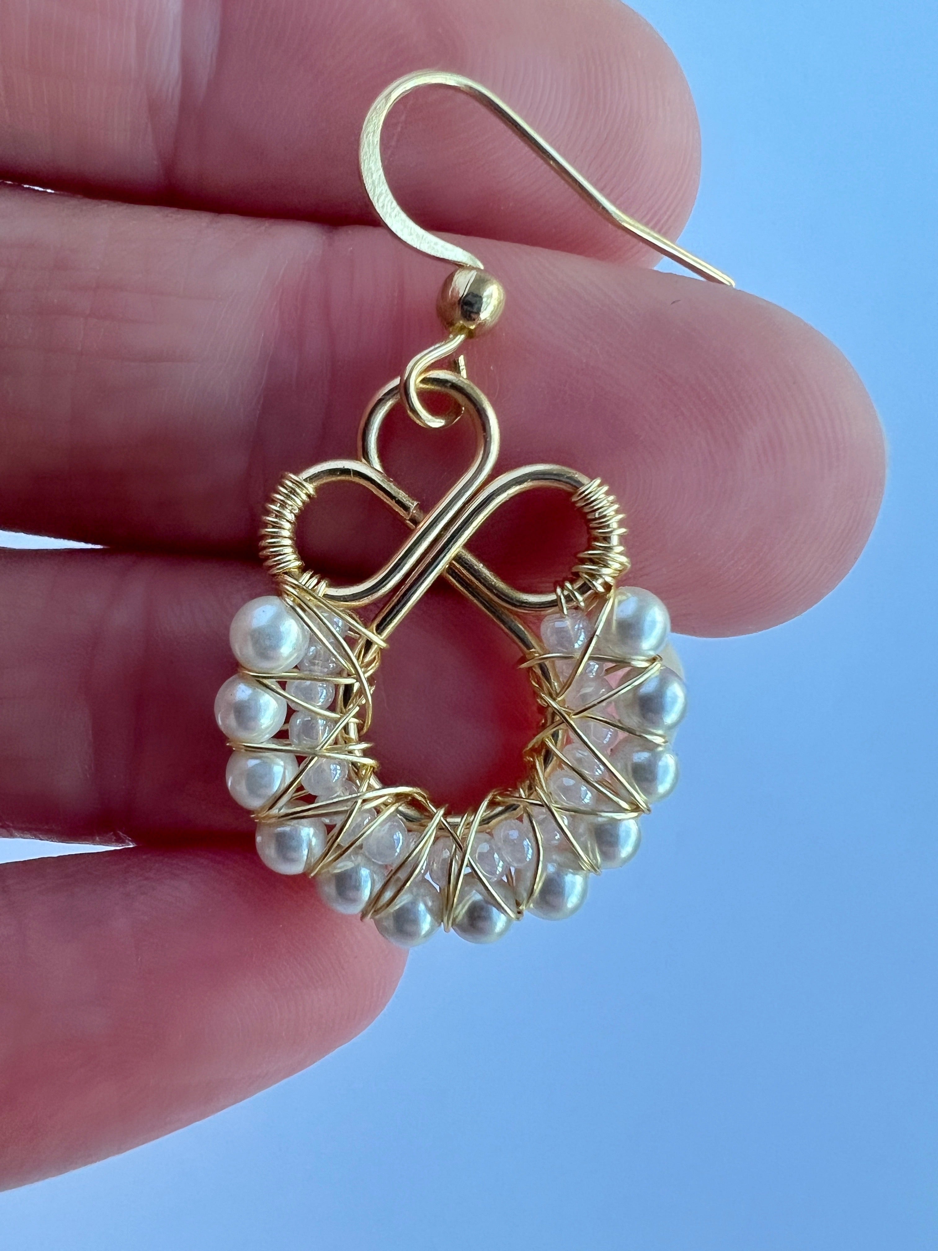Gold wire wrapped earrings with shell based peals and Czech seee beads