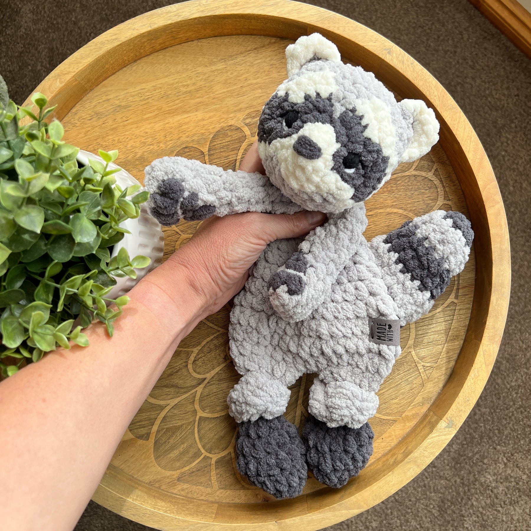 Handmade crochet modern Raccoon lovey snuggler with knotted legs.