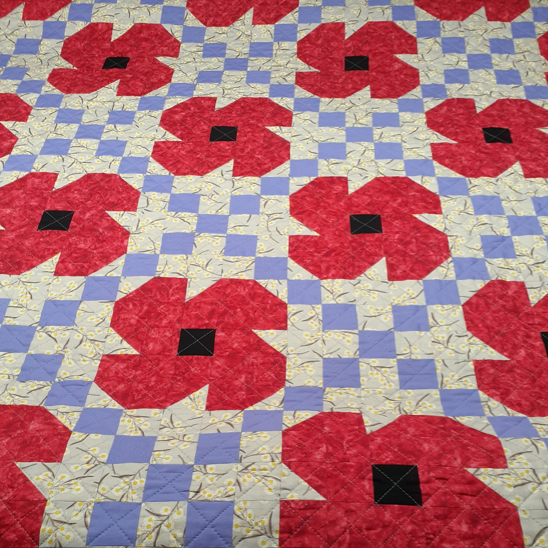 Red poppies Irish chain patchwork quilt