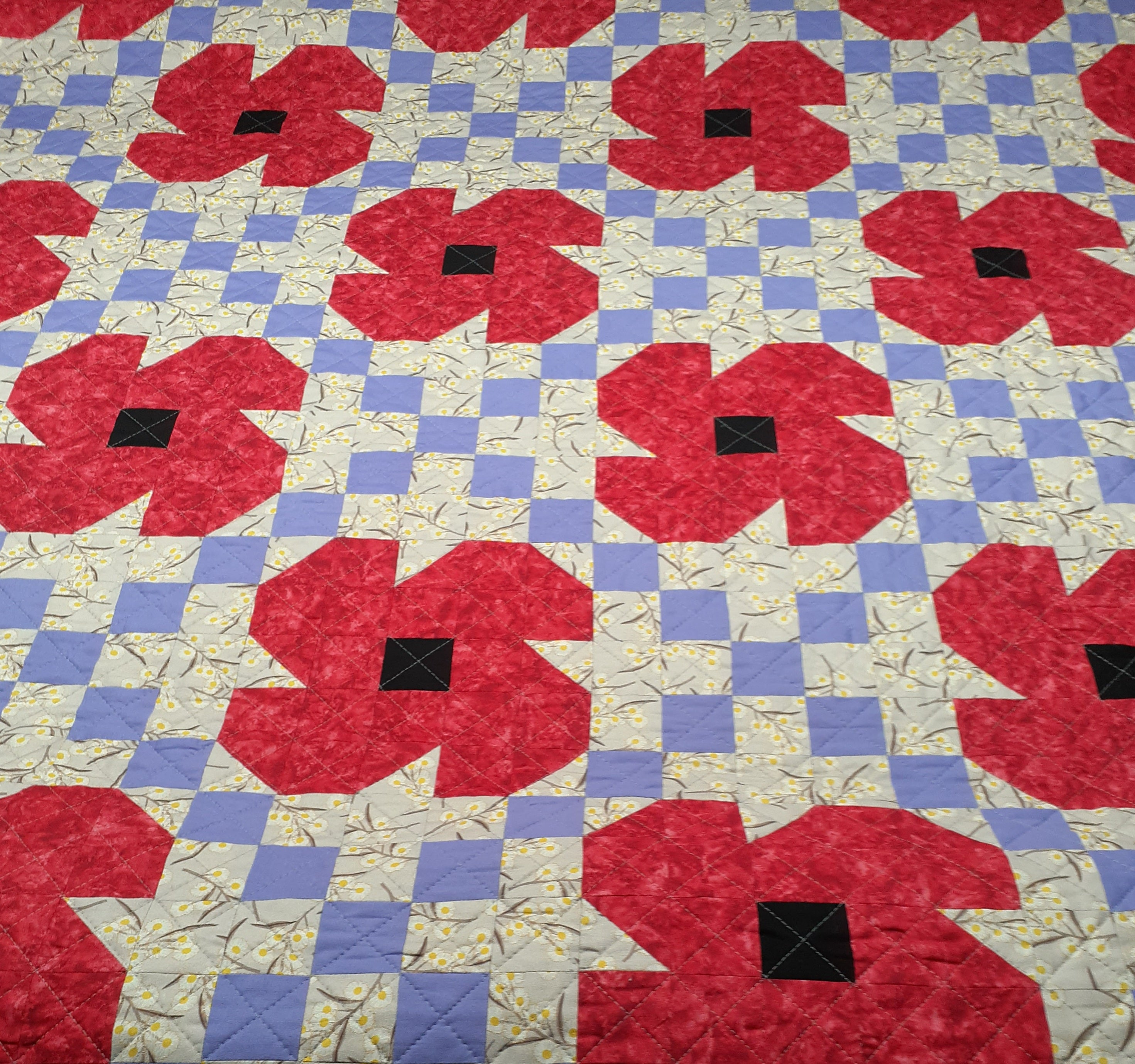 Red poppies Irish chain patchwork quilt