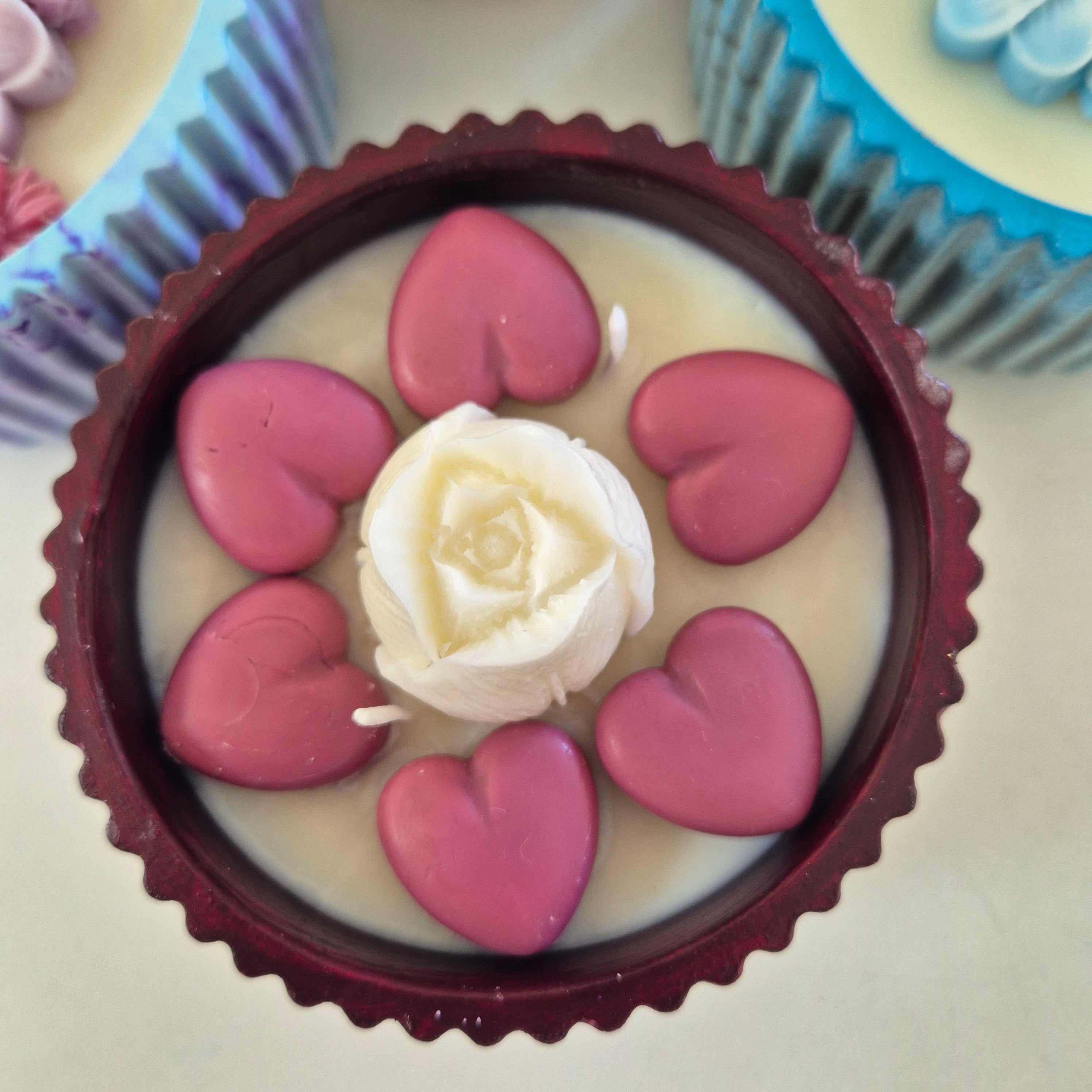 Round burgundy concrete bowl candle with tulip flower