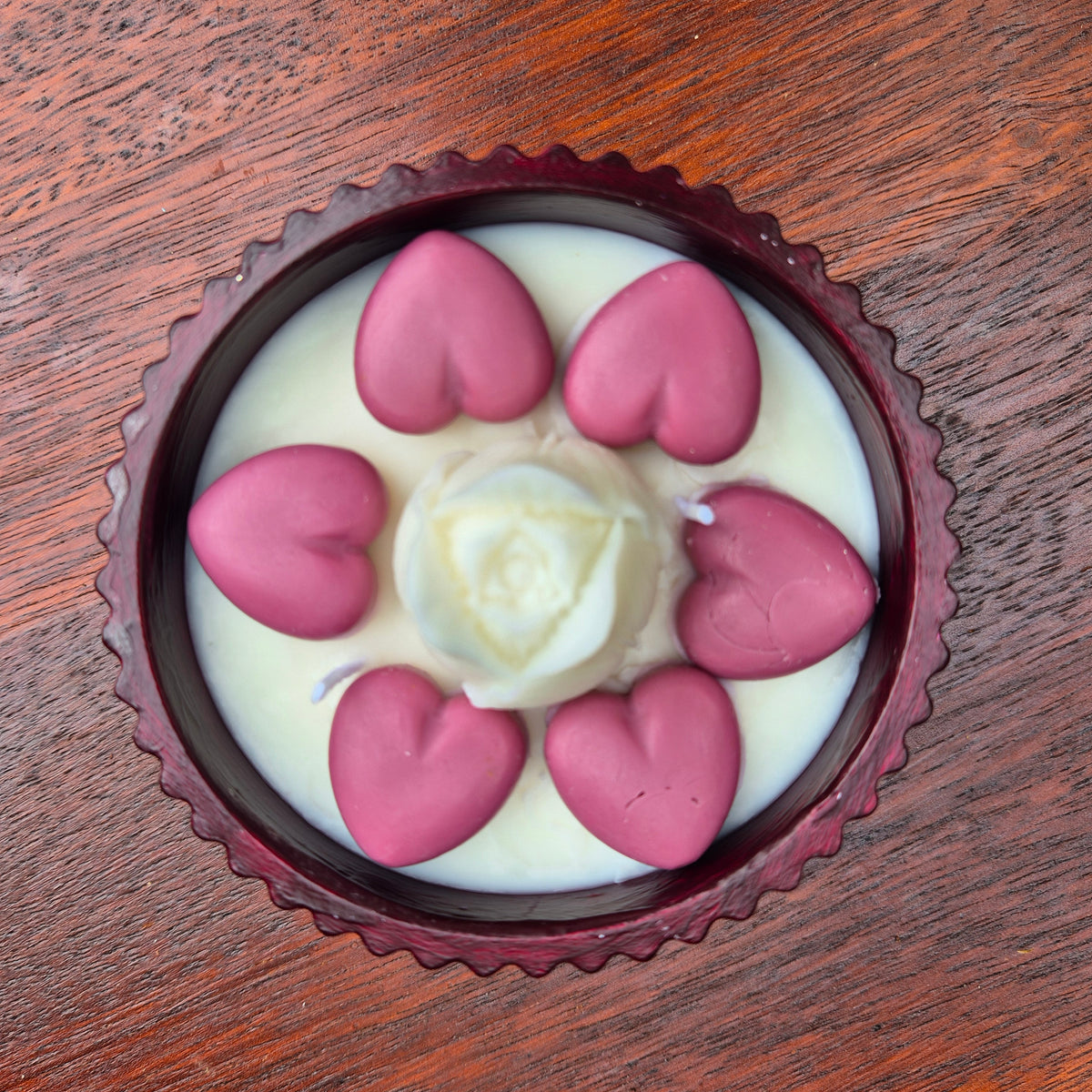 Round burgundy concrete bowl candle with tulip flower