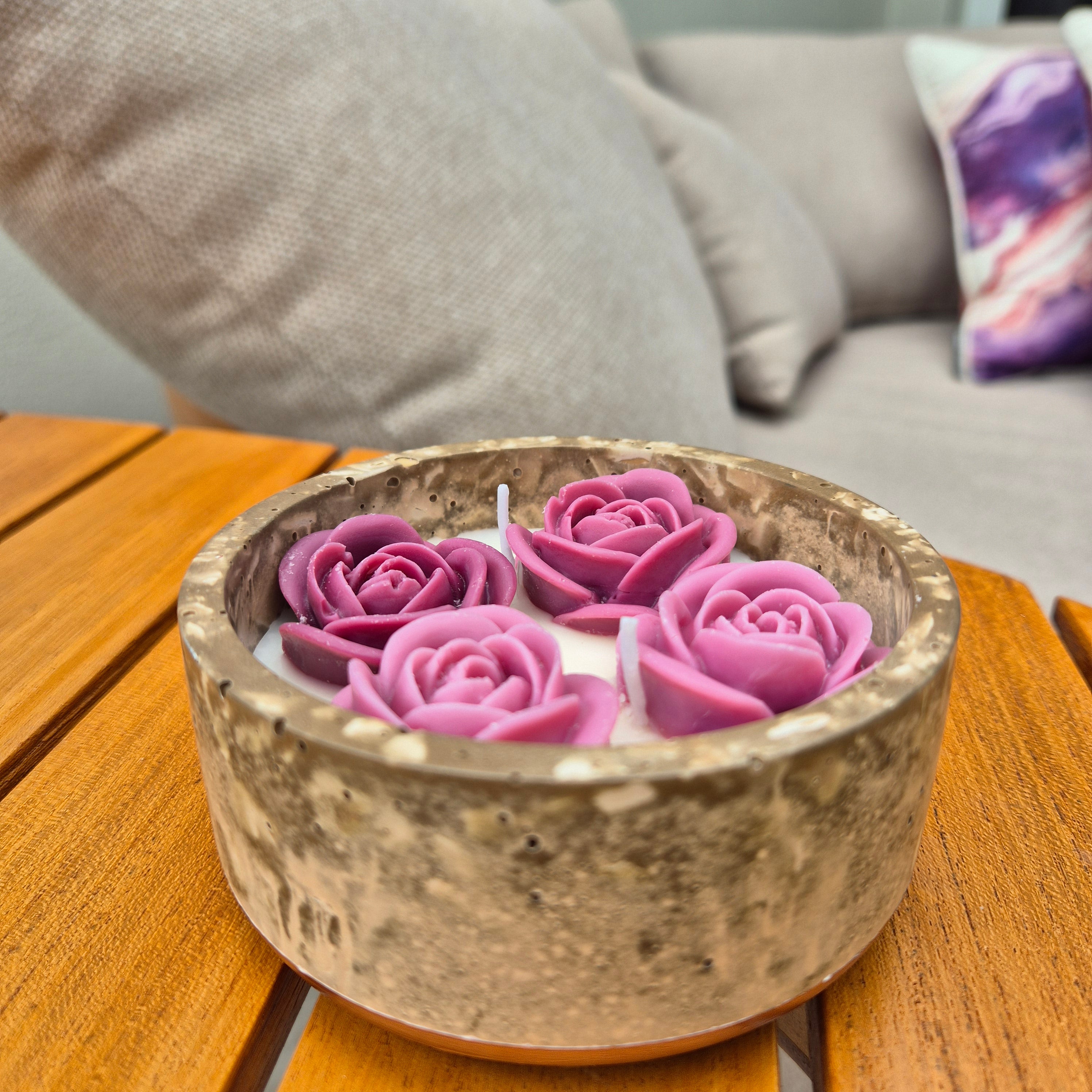 Round fluted brown concrete bowl candle with burgundy roses
