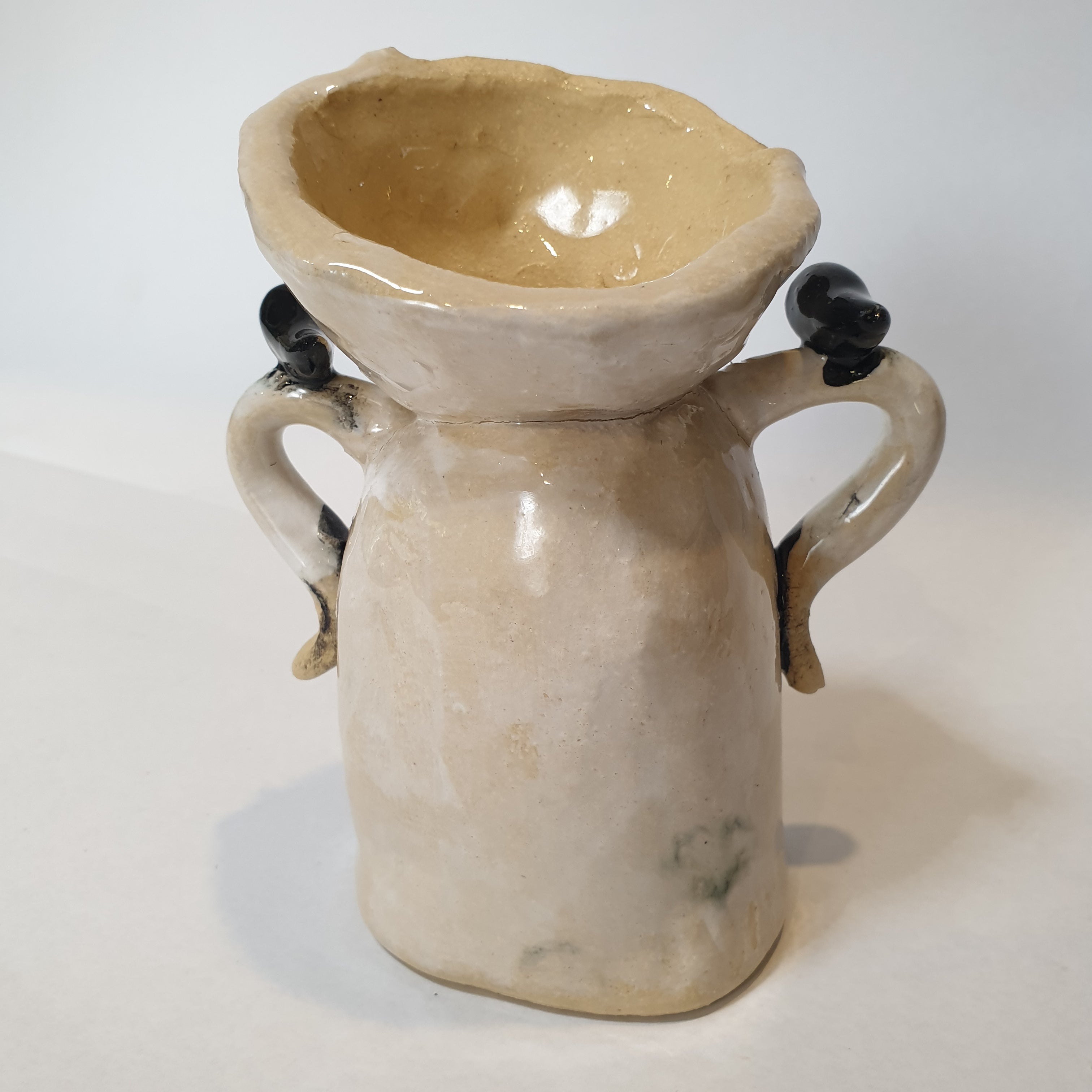 little clay person with birds