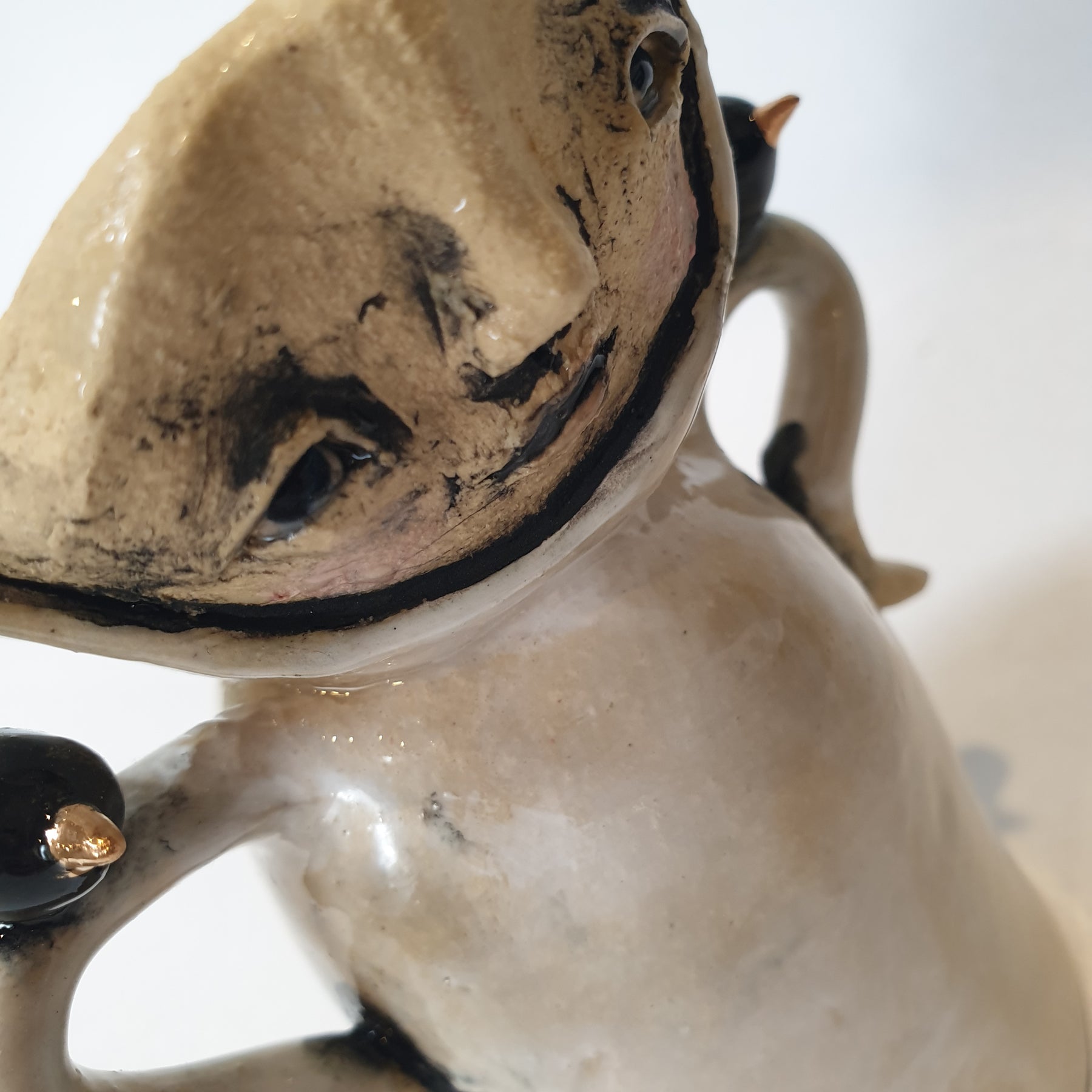 little clay person with birds