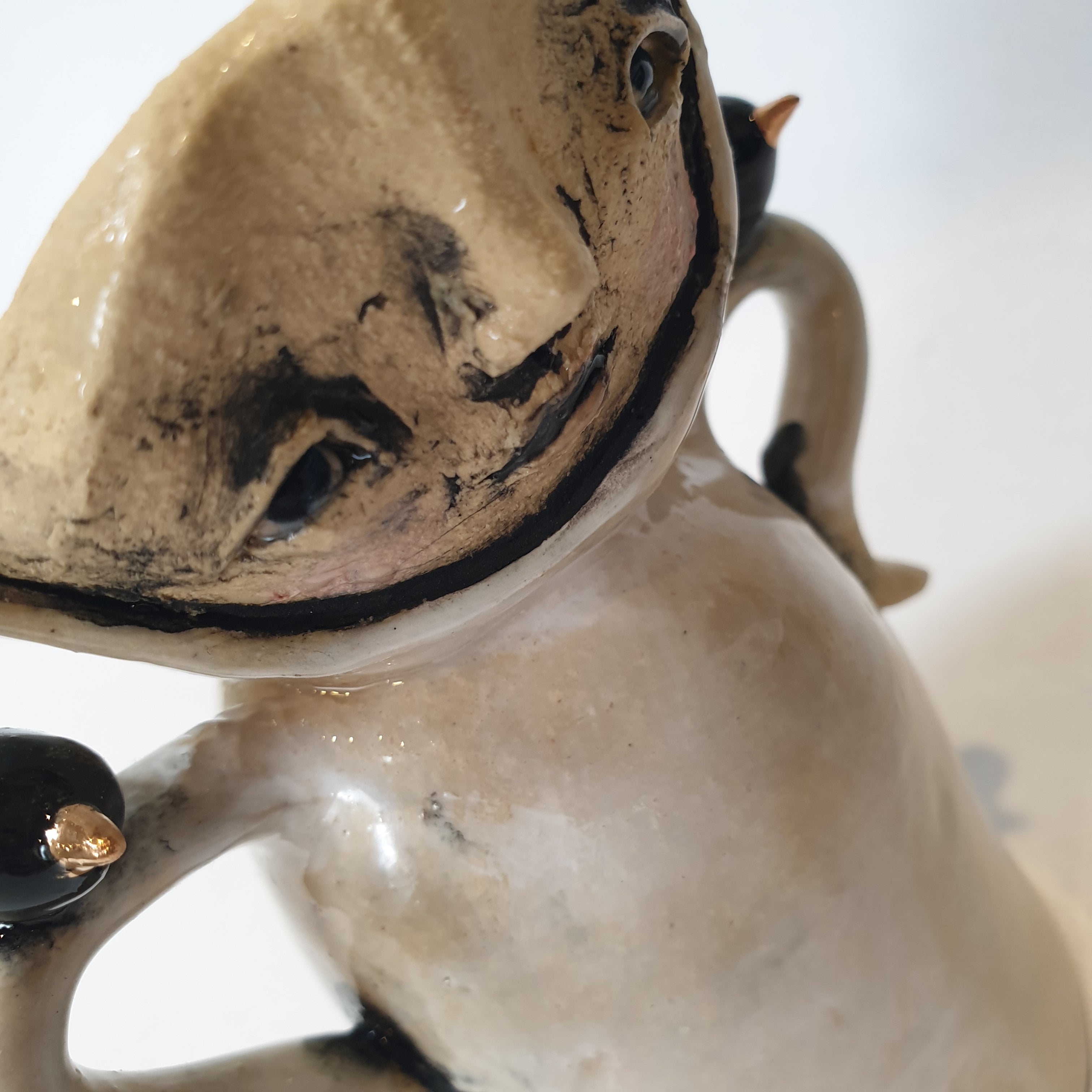 little clay person with birds