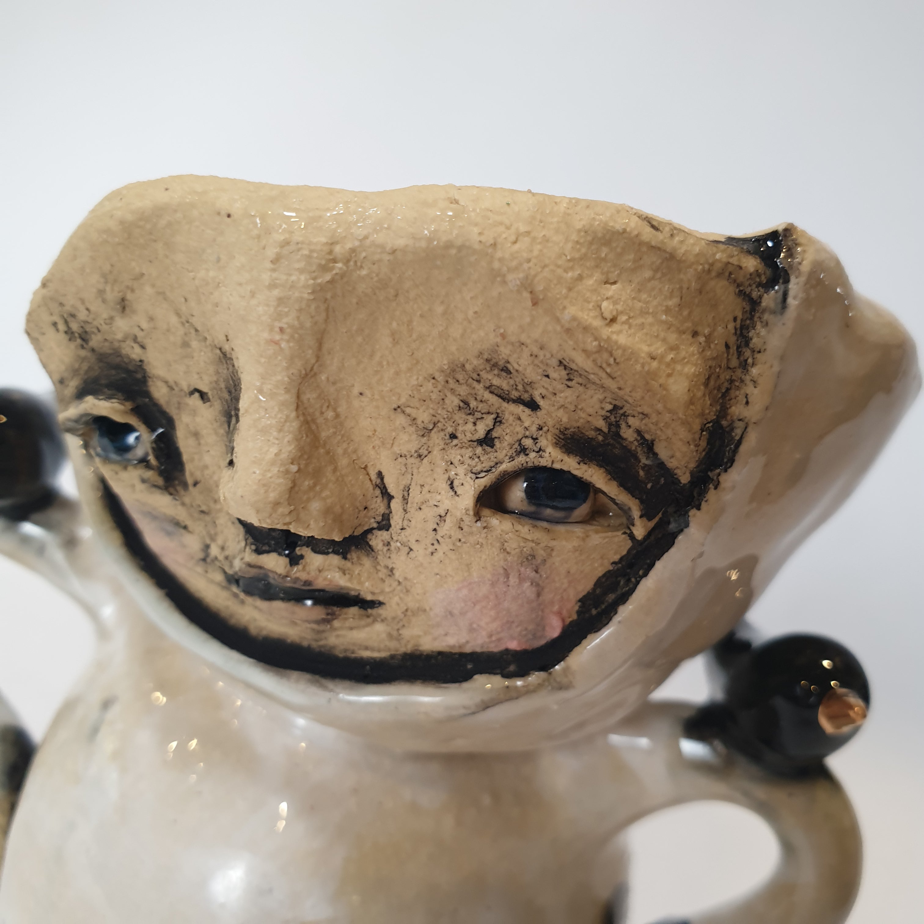 little clay person with birds