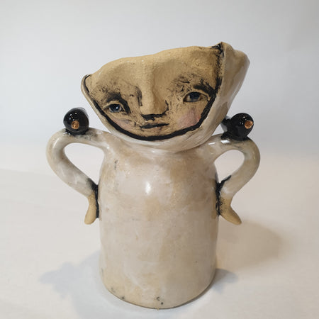little clay person with birds