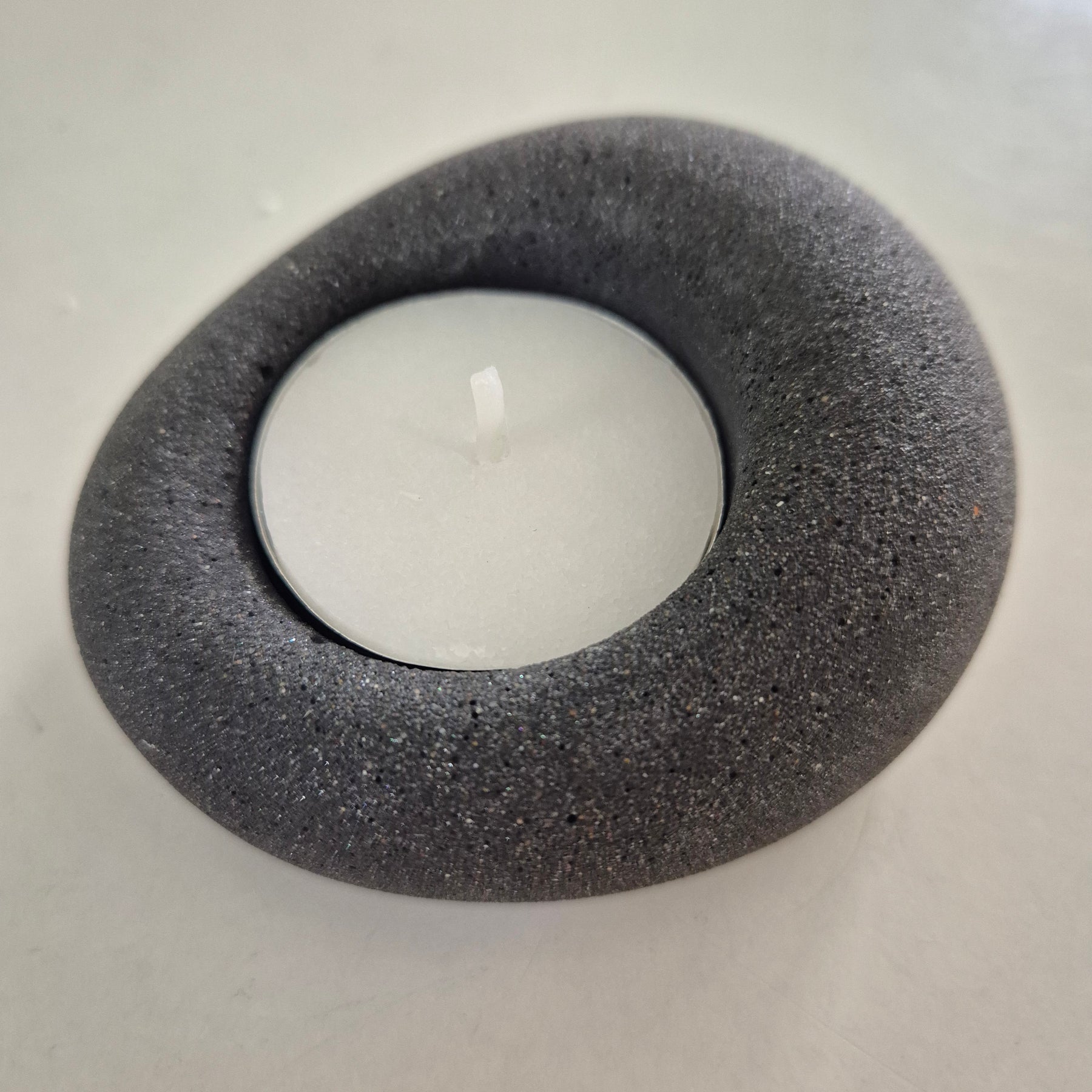 Black eco-stone pebble shaped tealight candle holder