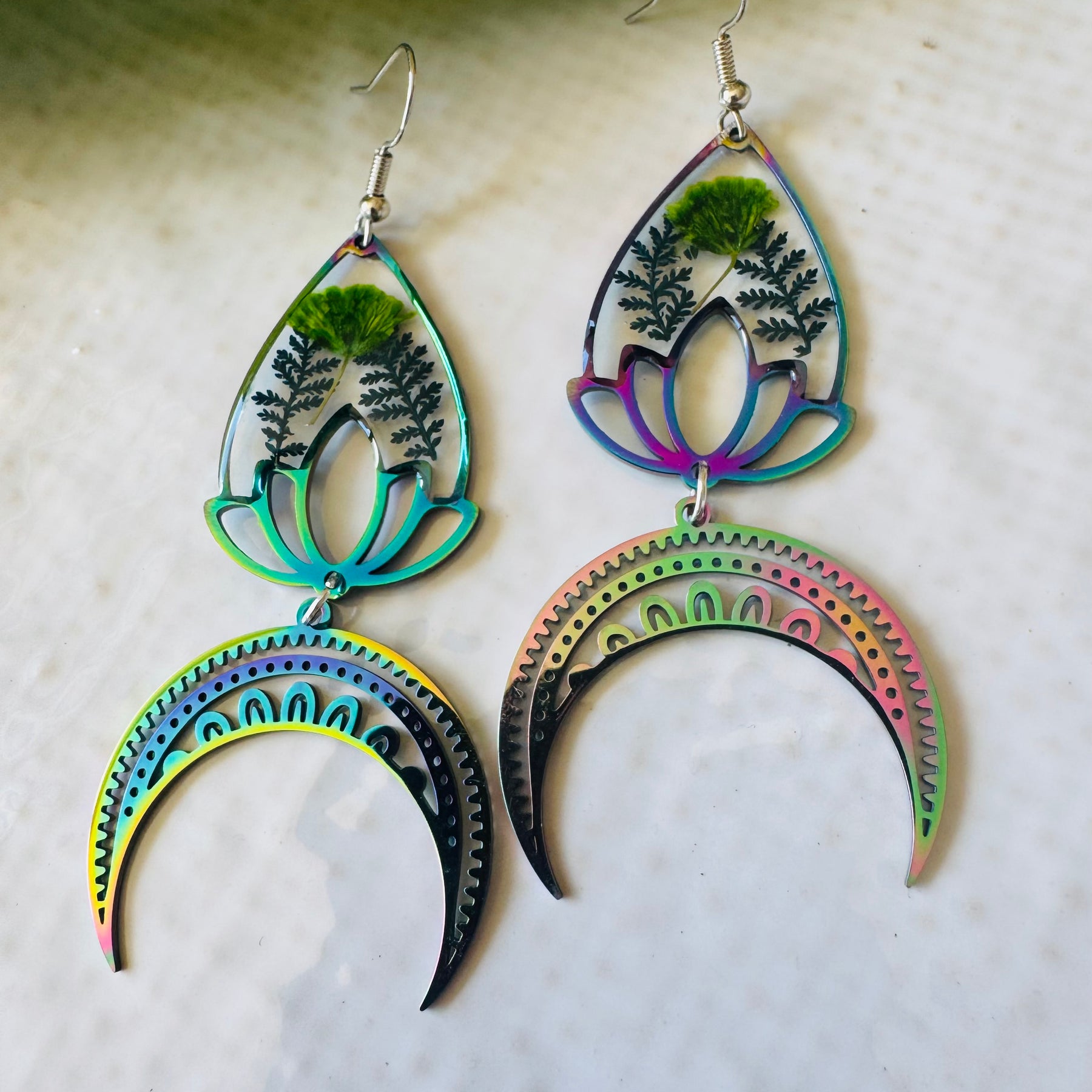 Iridescent rainbow resin earrings with pressed flowers