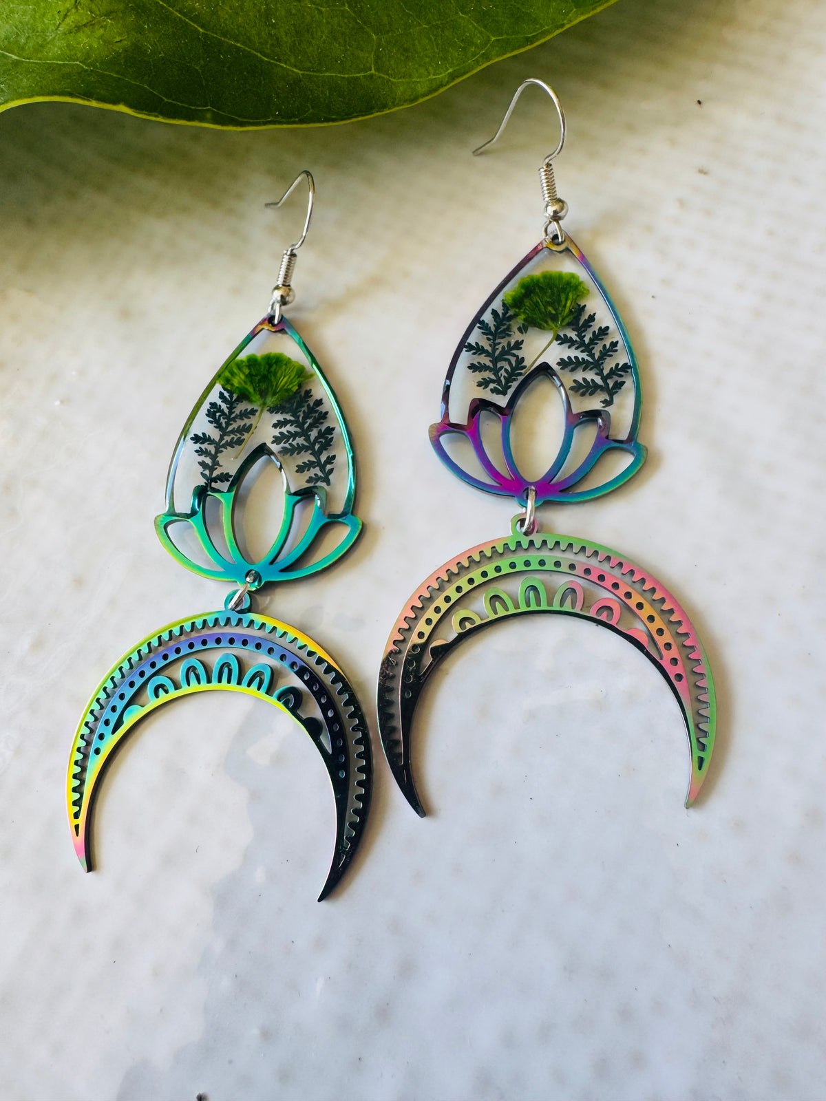 Iridescent rainbow resin earrings with pressed flowers