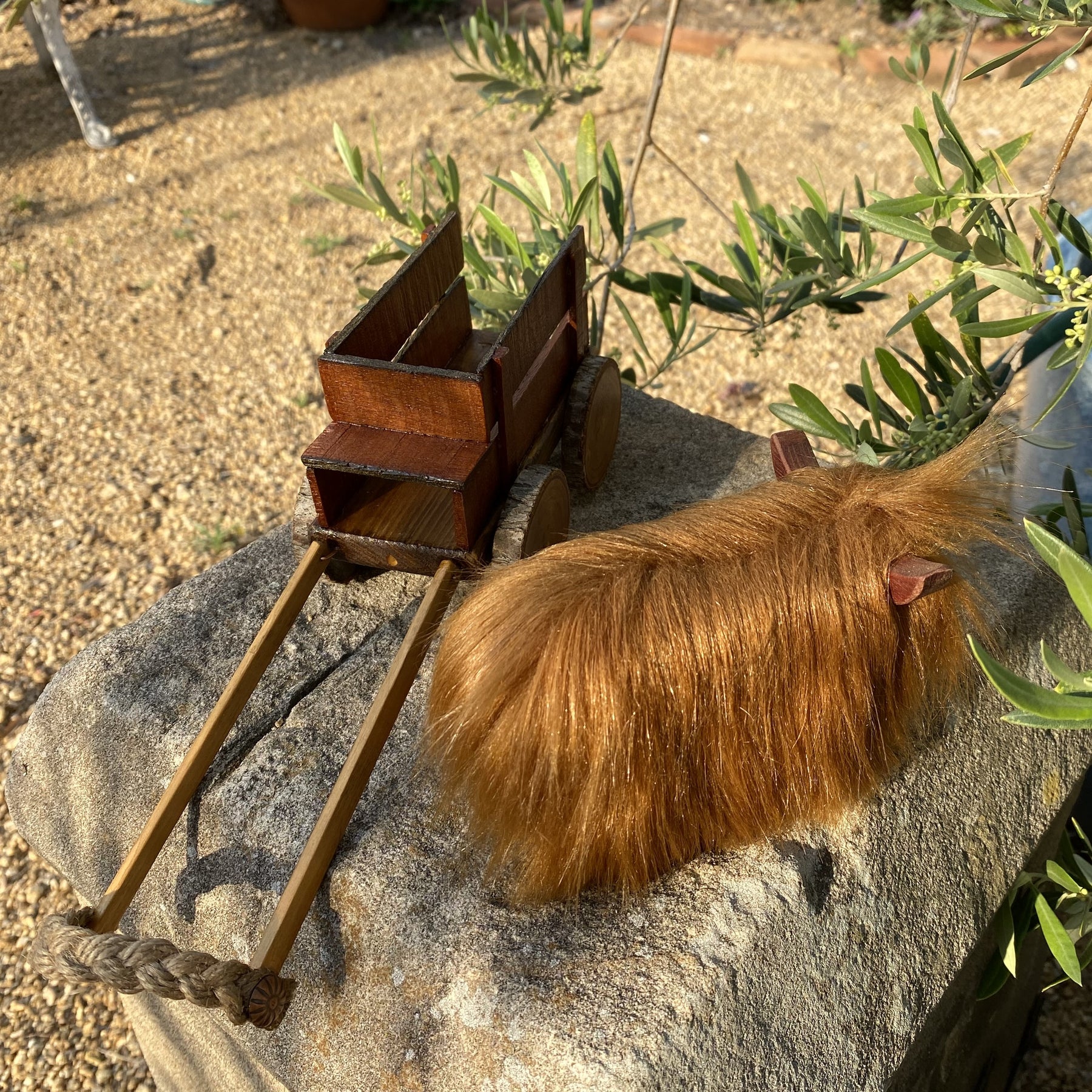 Handmade wooden cow and wagon