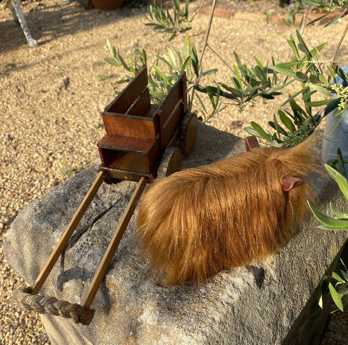 Handmade wooden cow and wagon