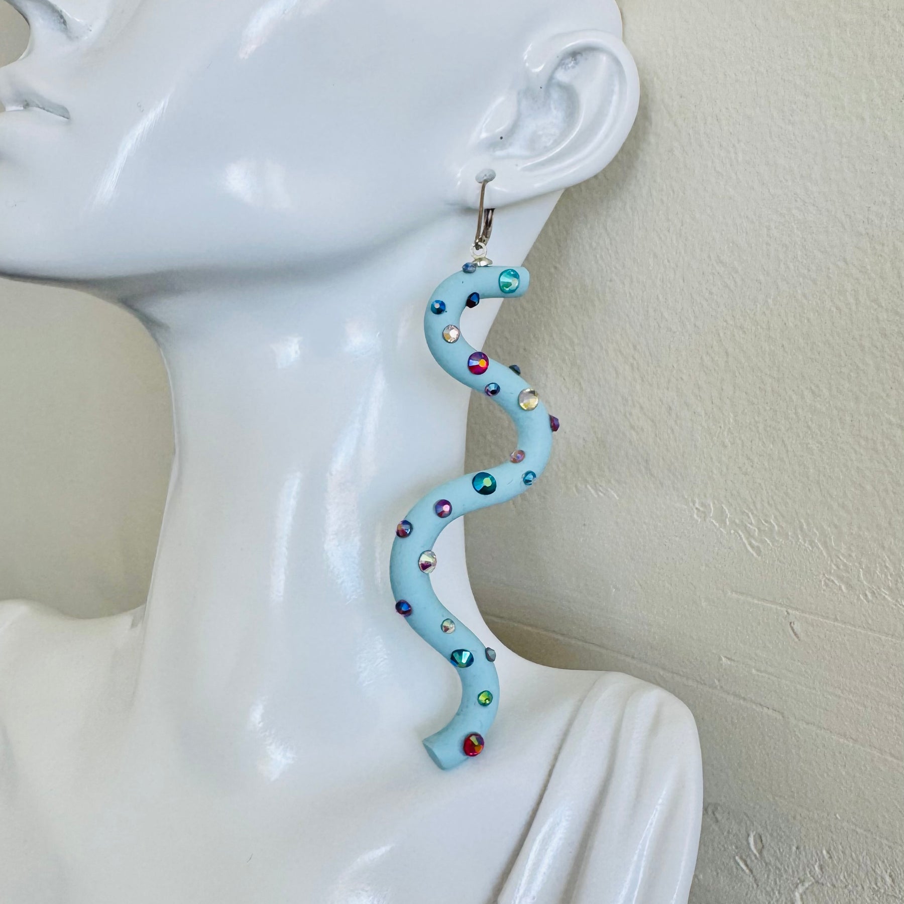 Pastel blue squiggle polymer clay earrings with holographic gems